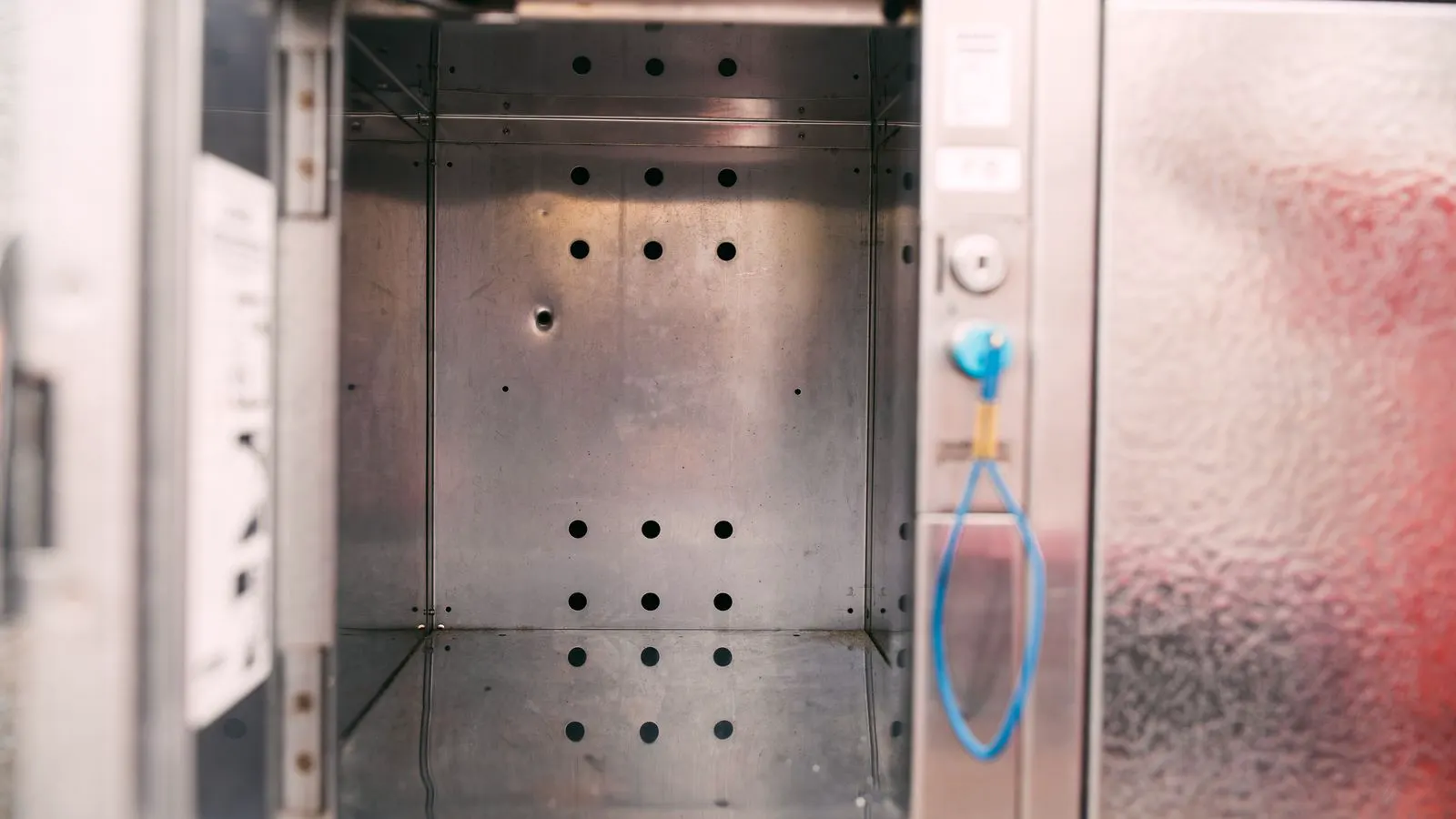A clean industrial room with two large battery cabinets