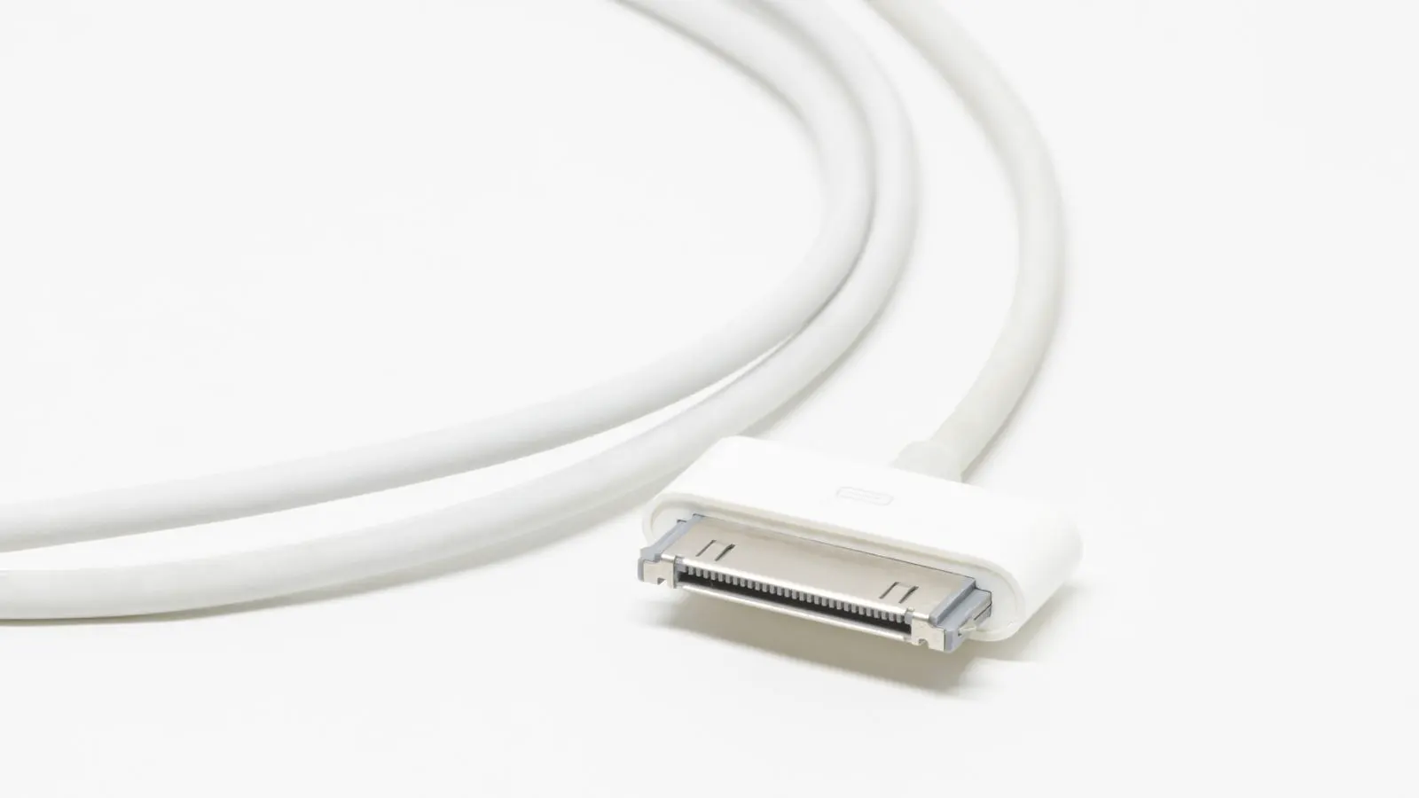 Close up of a charging cable plugged into an EV socket