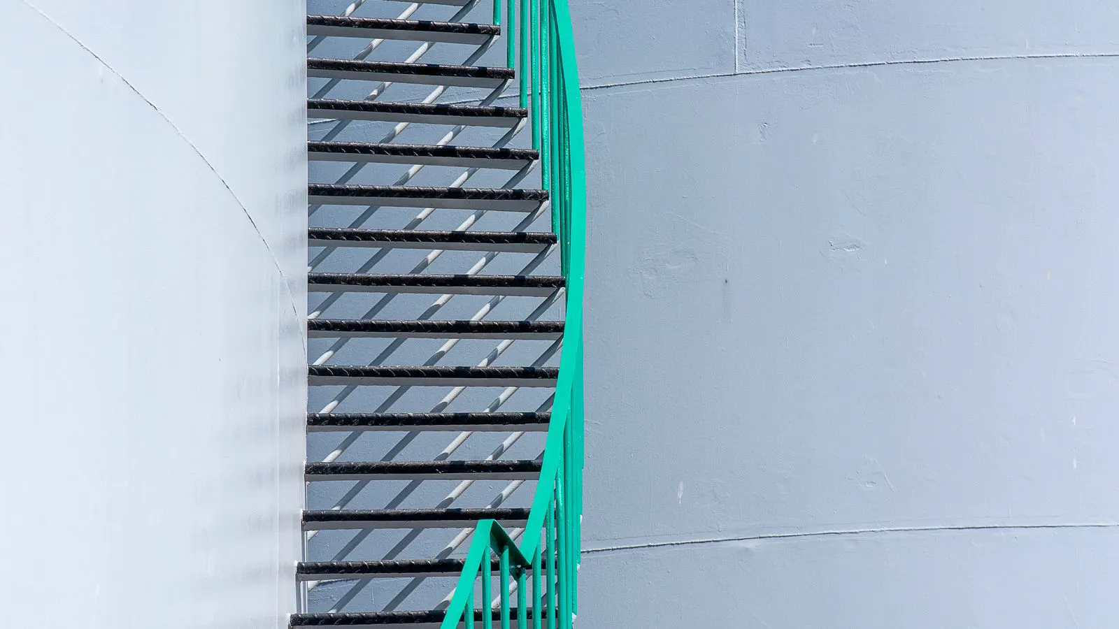 Large stainless steel filtration vessel with piping in a plant