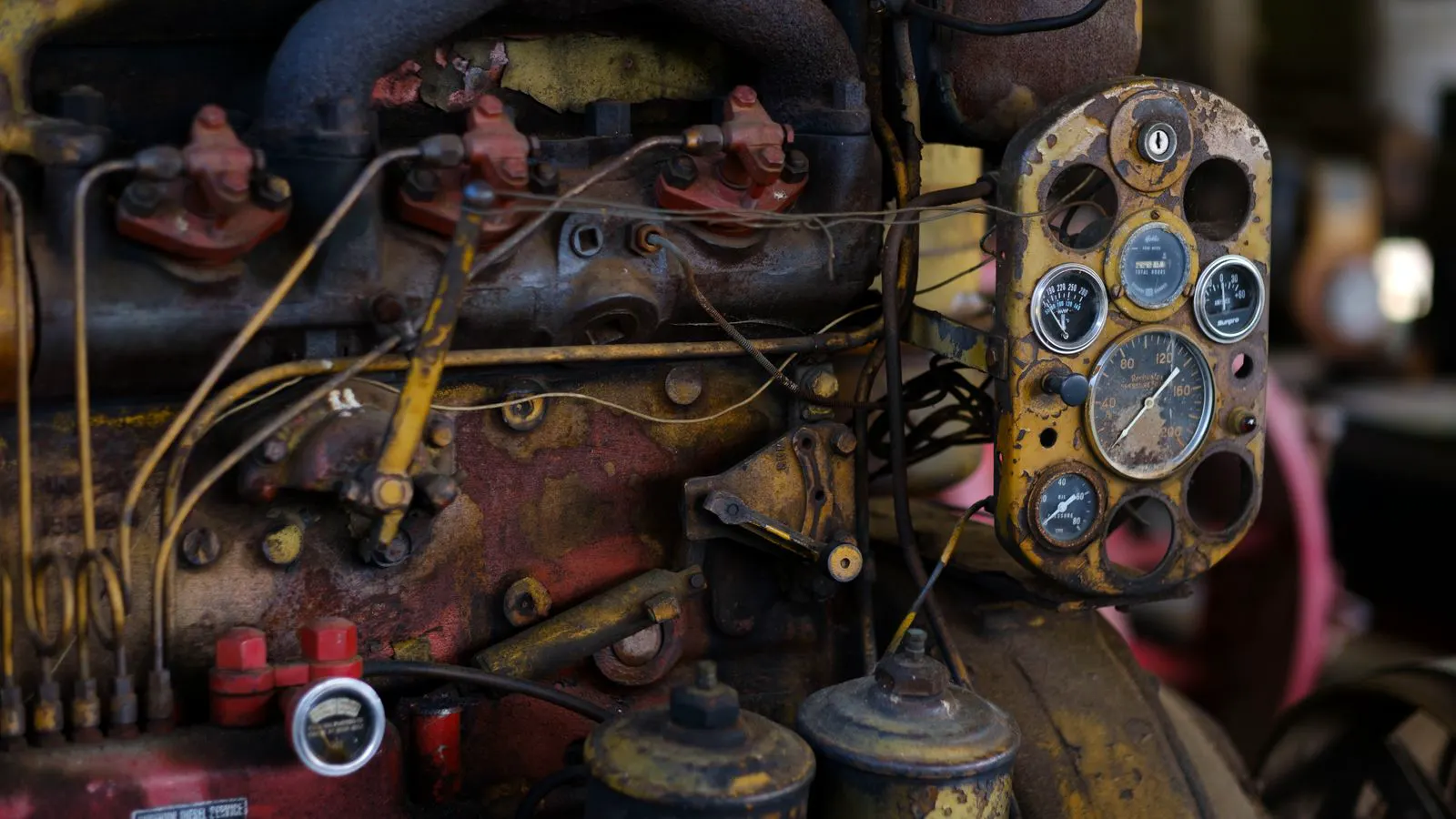Close up of a metal heat exchanger with pressure gauges attached