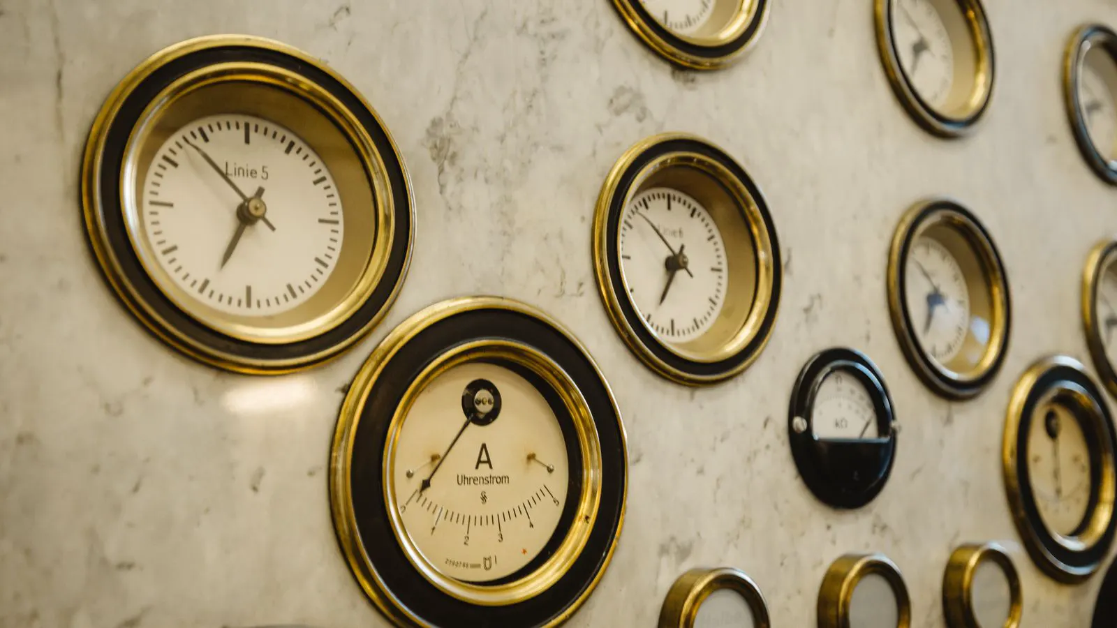 Close up of brass architectural hardware on a metal panel