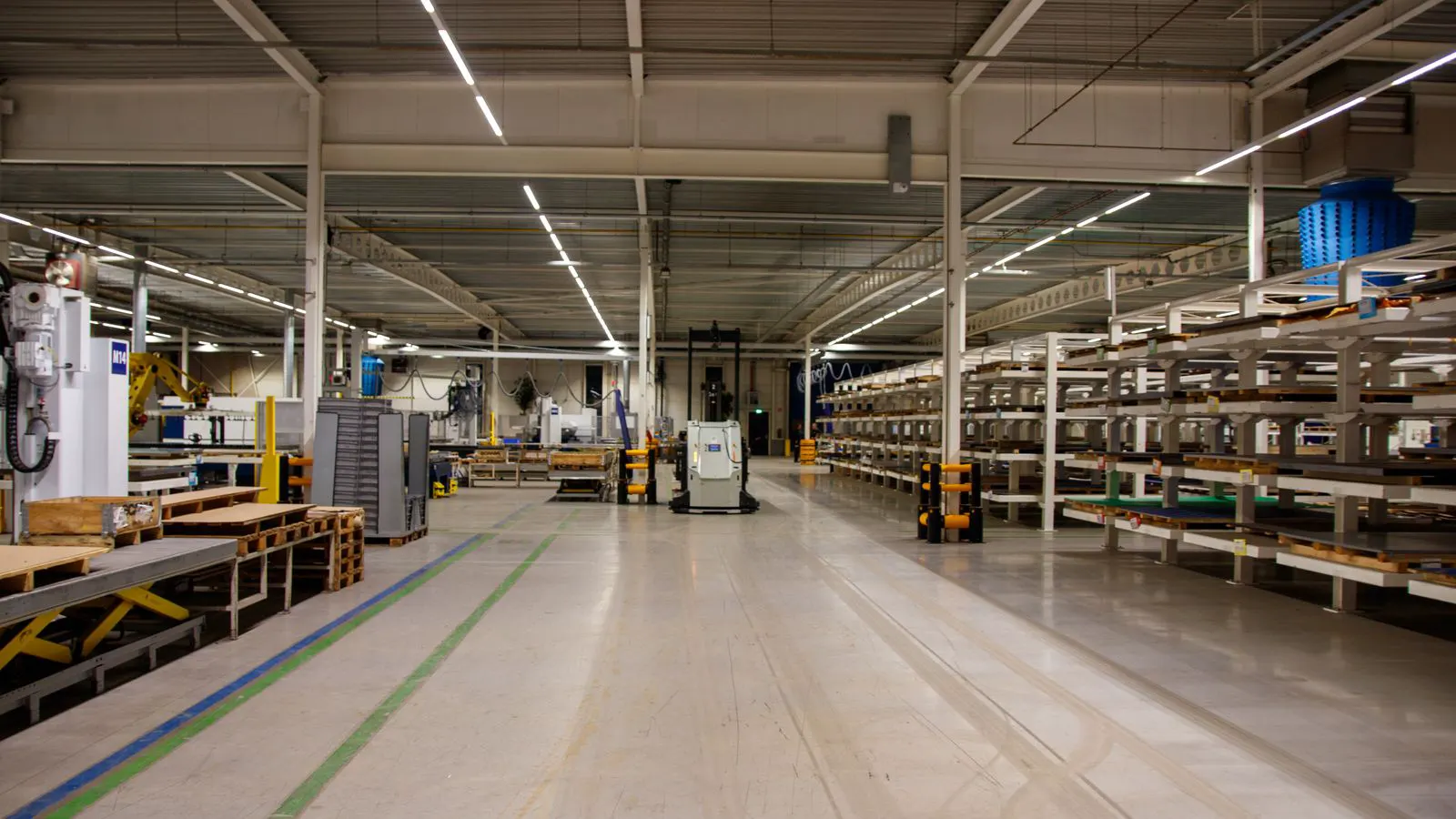 Large plastic resin pellets stacked in bags inside a warehouse