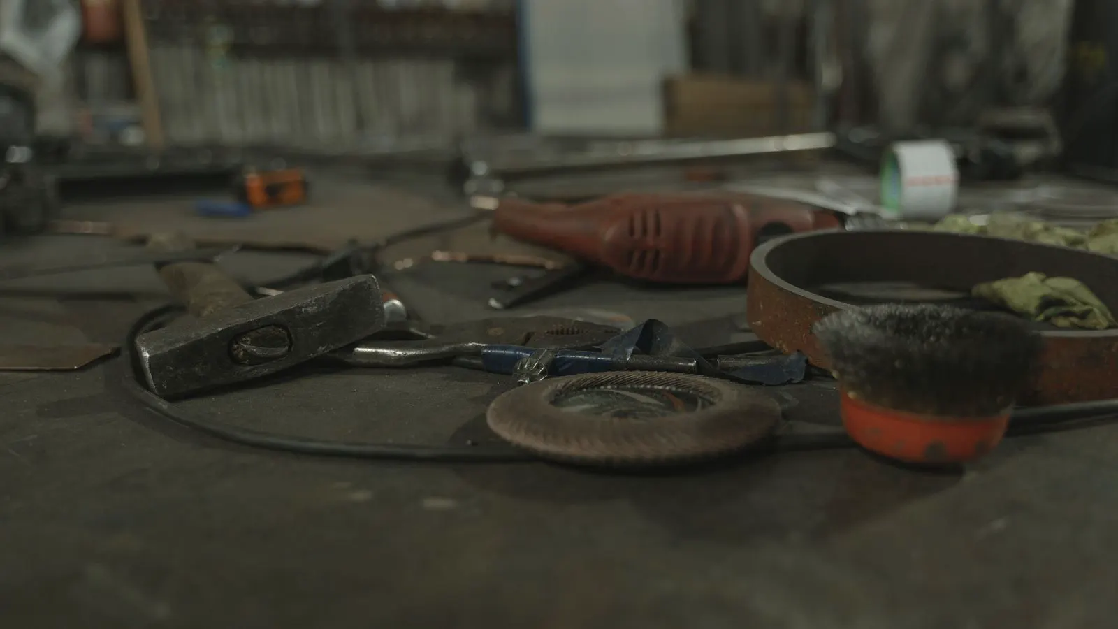 Close up of various rubber O rings and gaskets on a metal workbench.