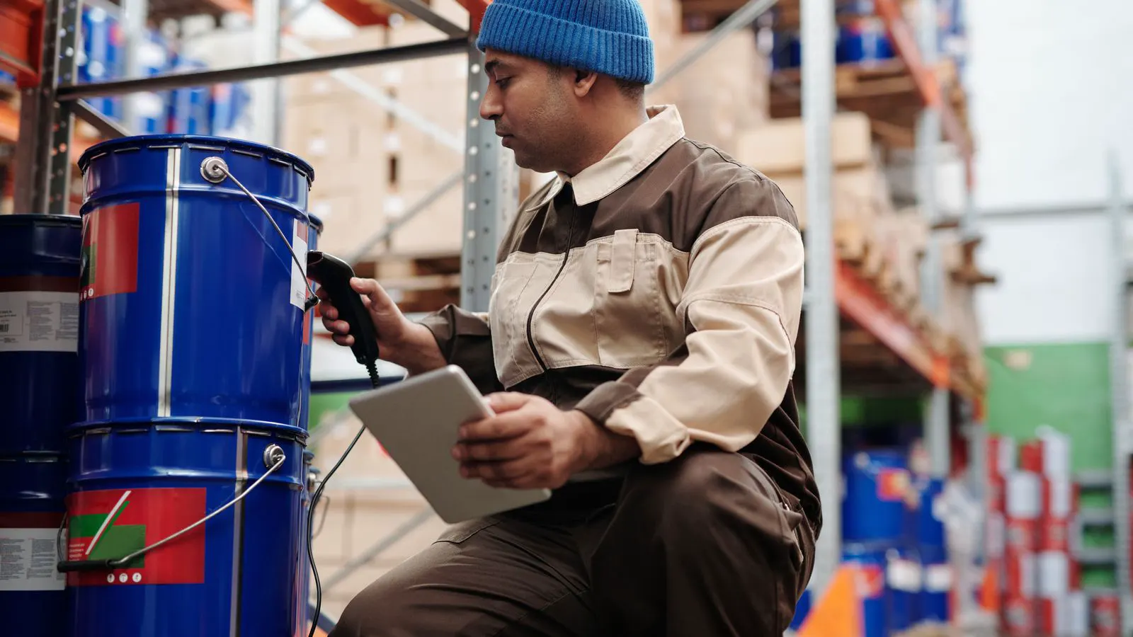 A worker inspecting a steel surface before applying industrial coating