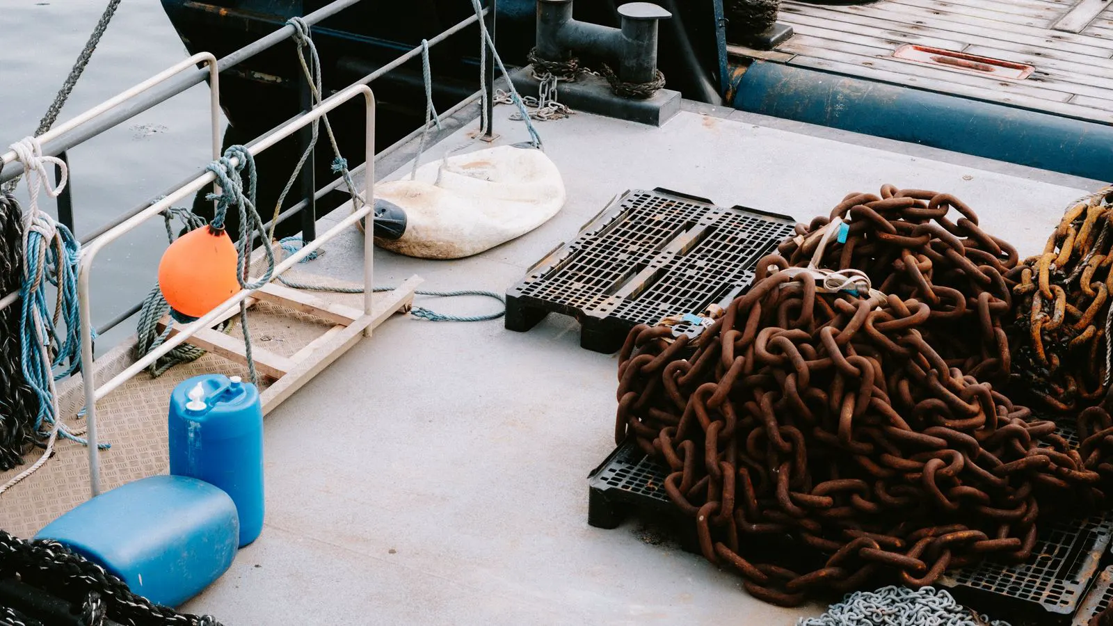 Industrial barrels of adhesive on a dock floor