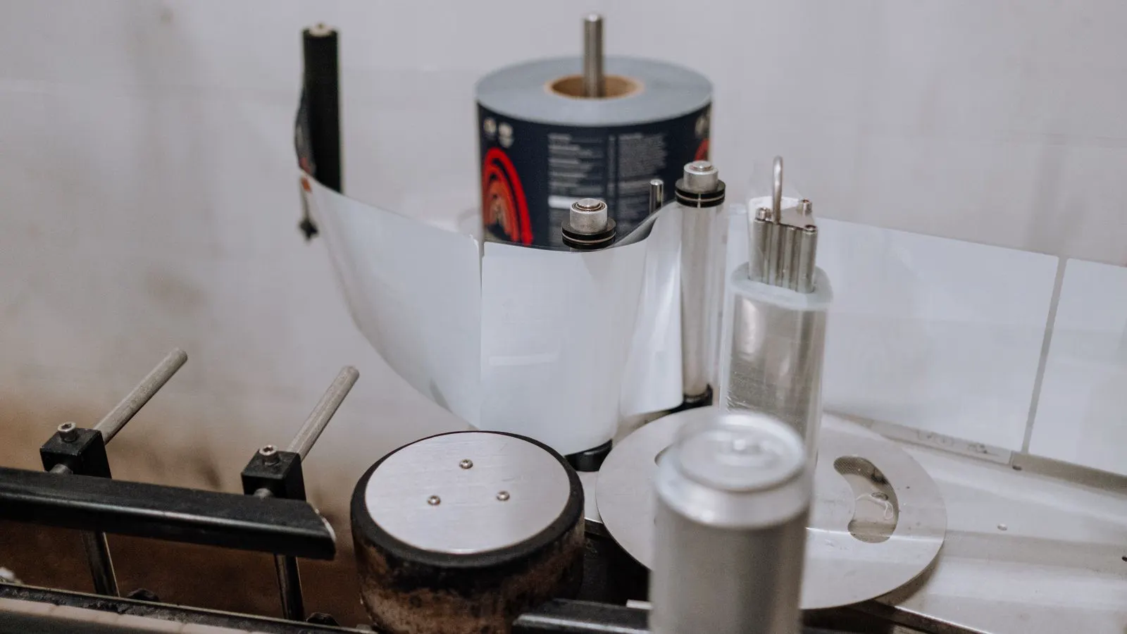 Close view of a roll of adhesive tape on a production line.