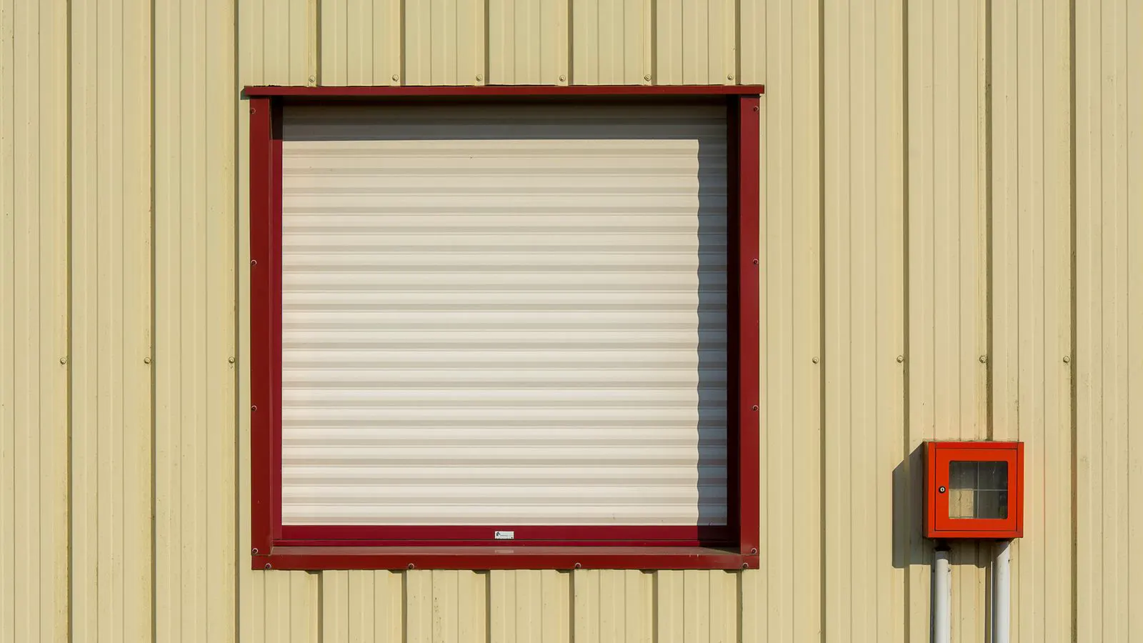 Close view of a window flashing joint with fresh sealant bead.