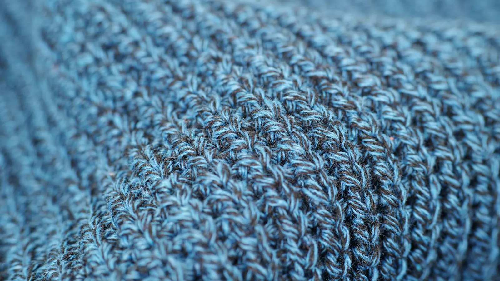 Close up of woven carbon fiber textile showing fiber weave pattern