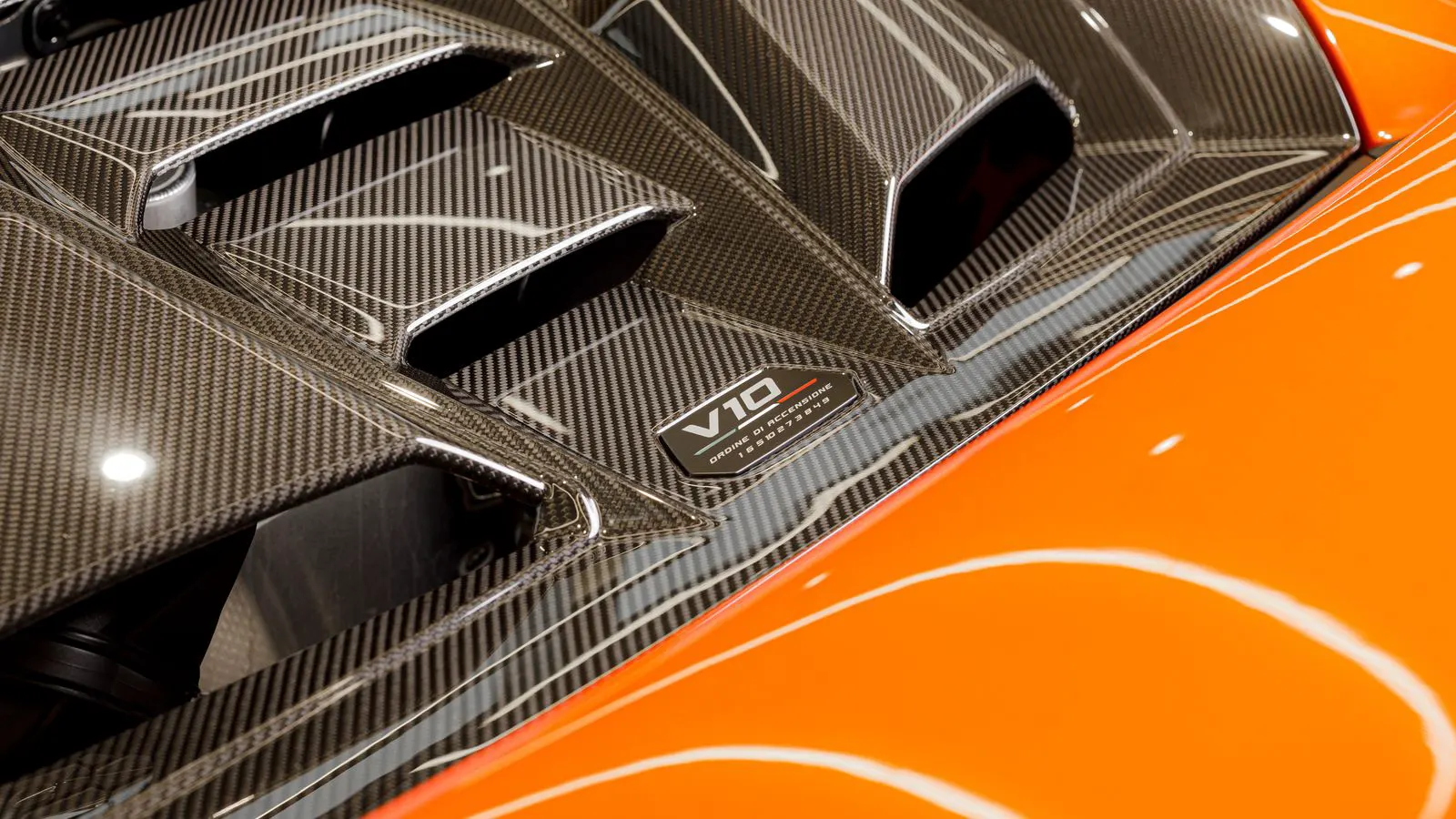 Two sheets of fiber-reinforced polymer showing different weave patterns and colors