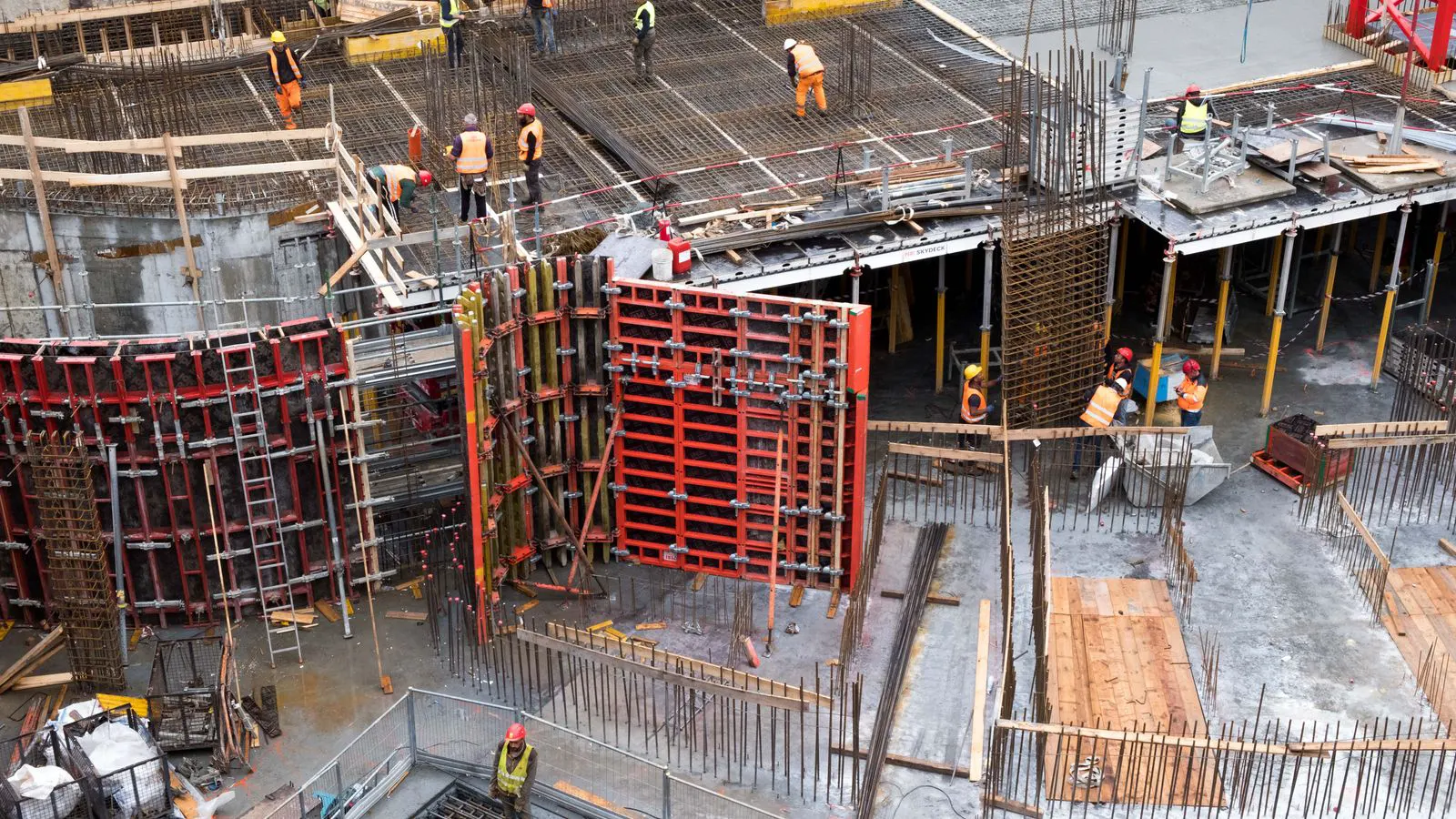 A steel building frame with diagonal bracing members at a joint.