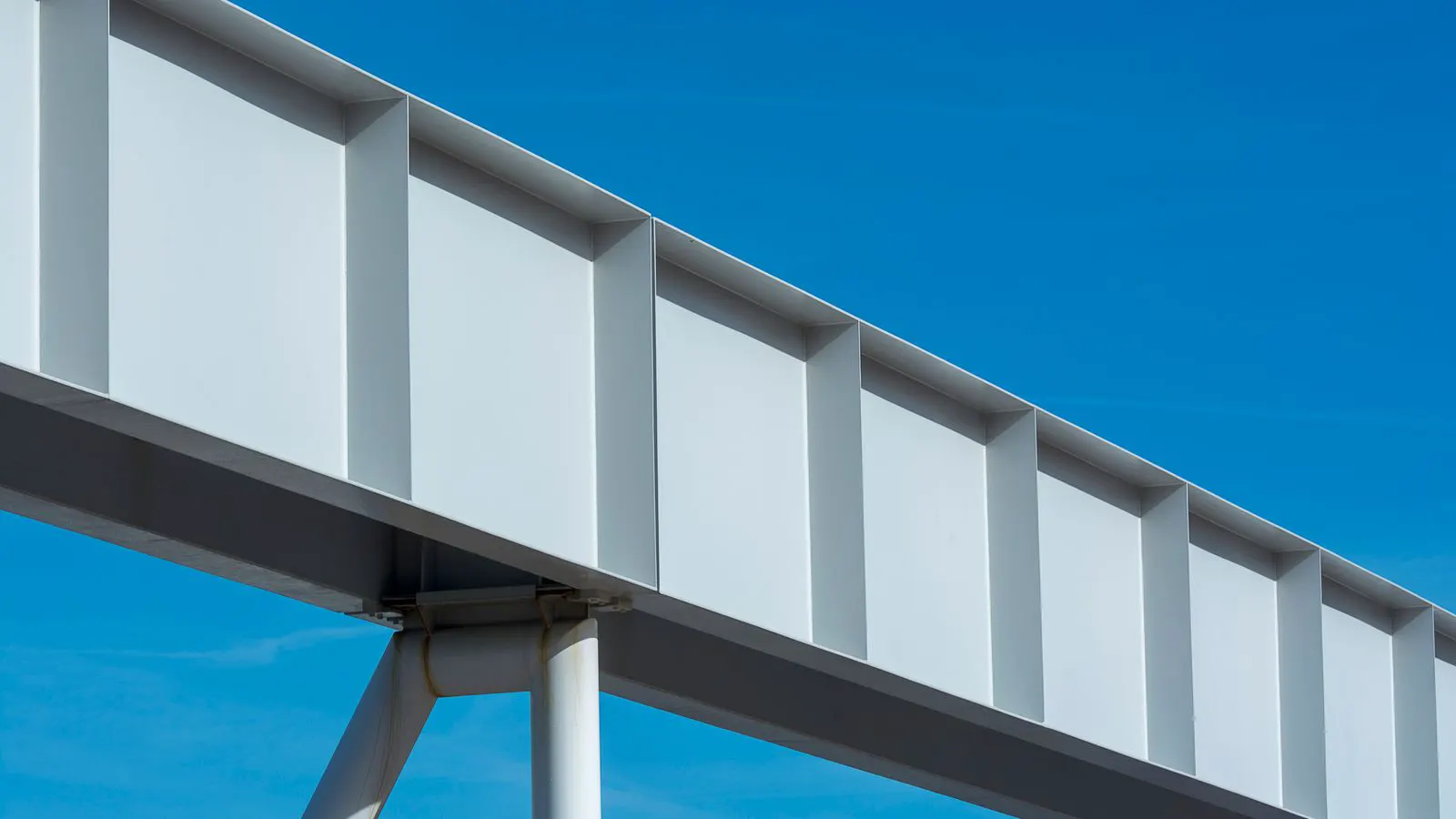 Weathered galvanized steel beam near a coastal construction site