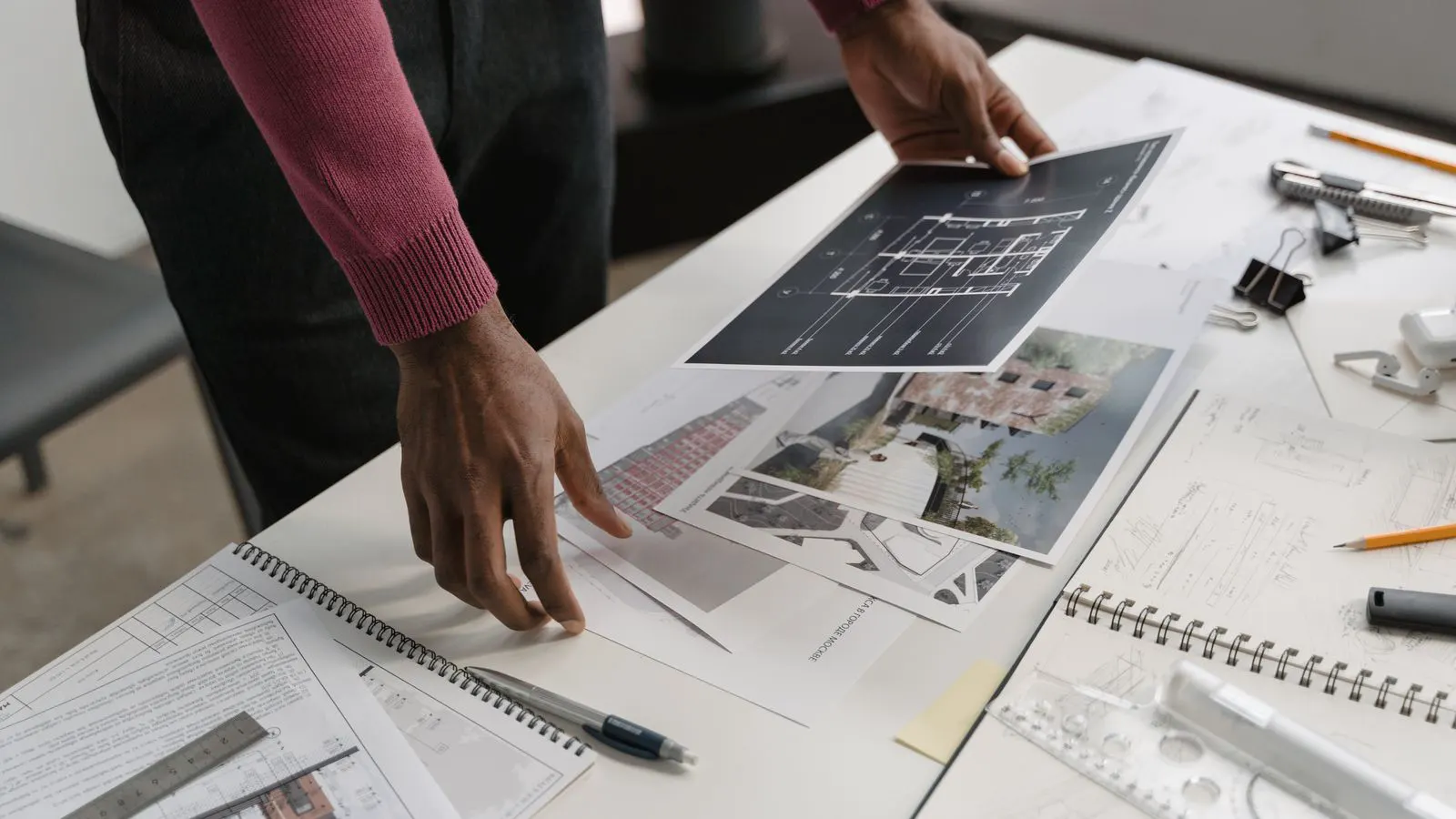A detailed steel structure building blueprint on a drafting table