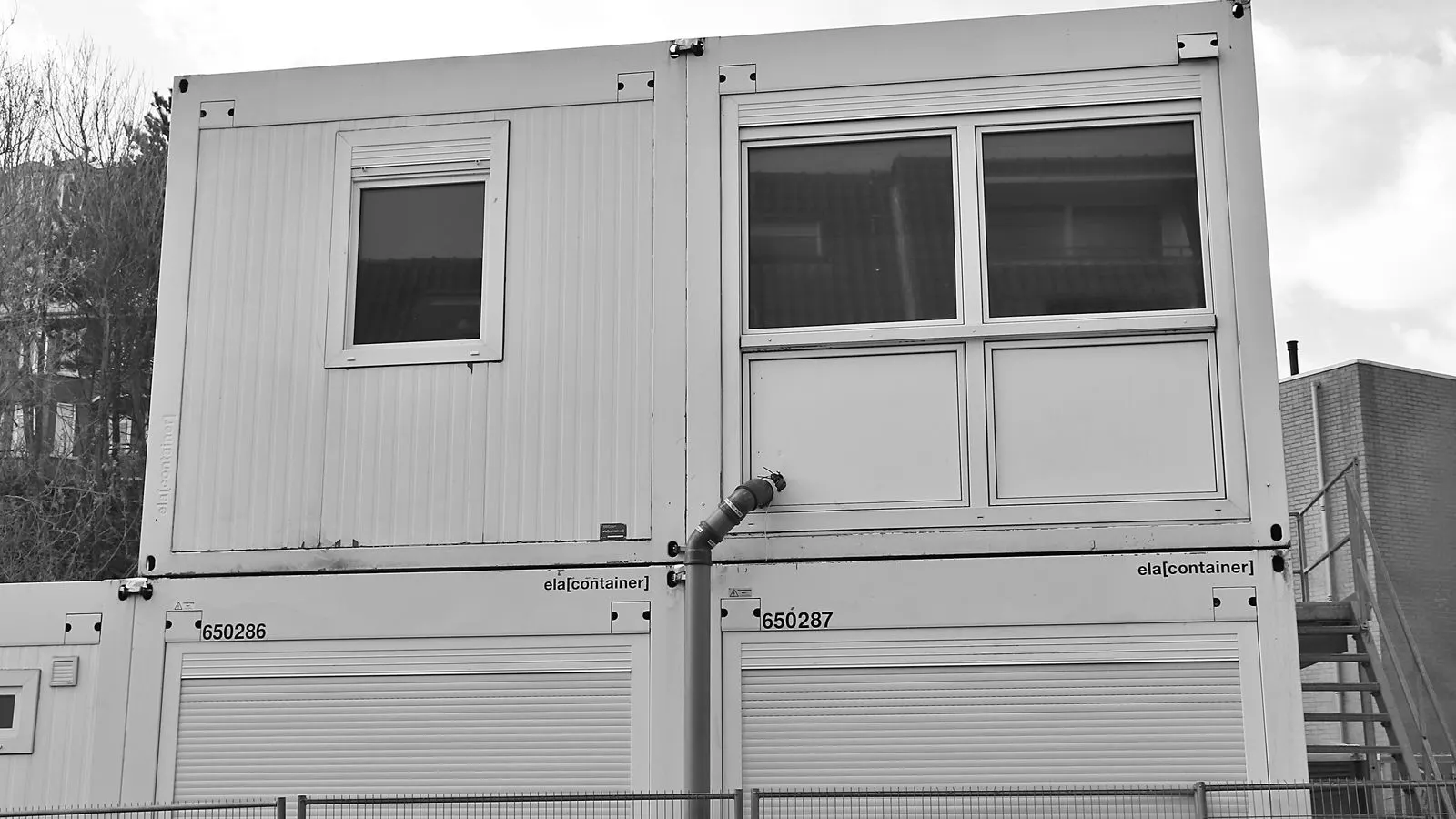 Steel frame of a shipping container building under construction