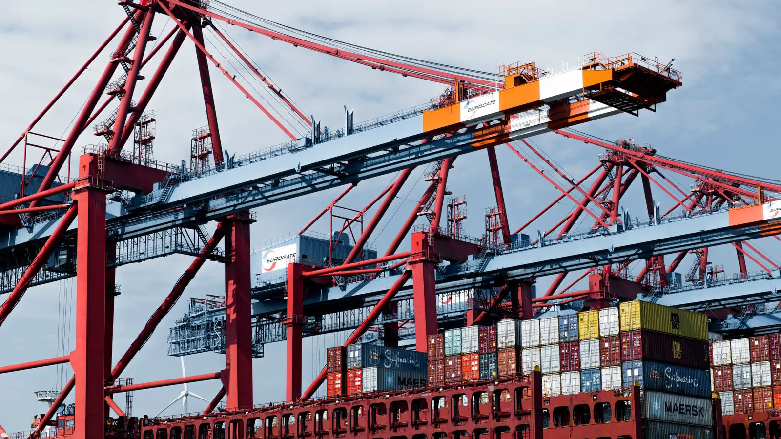 Stack of steel shipping containers on a yard