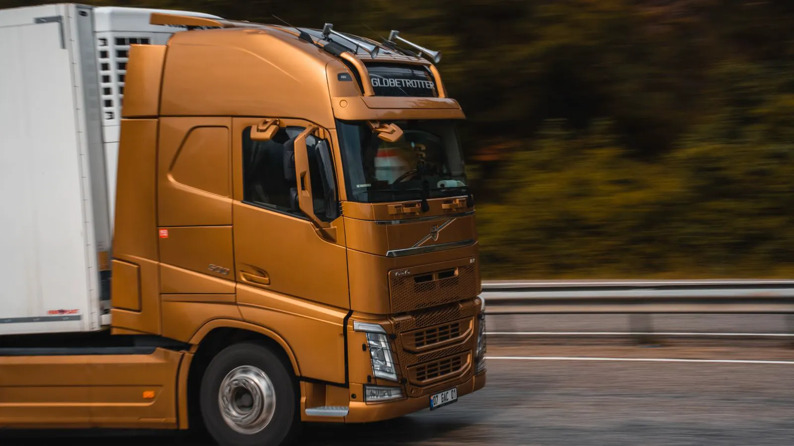 Large flatbed truck carrying modular units on a highway