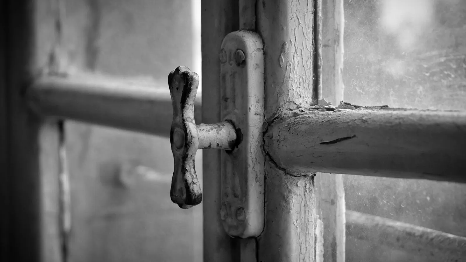 Close view of a heavy duty commercial window hinge and latch mechanism.