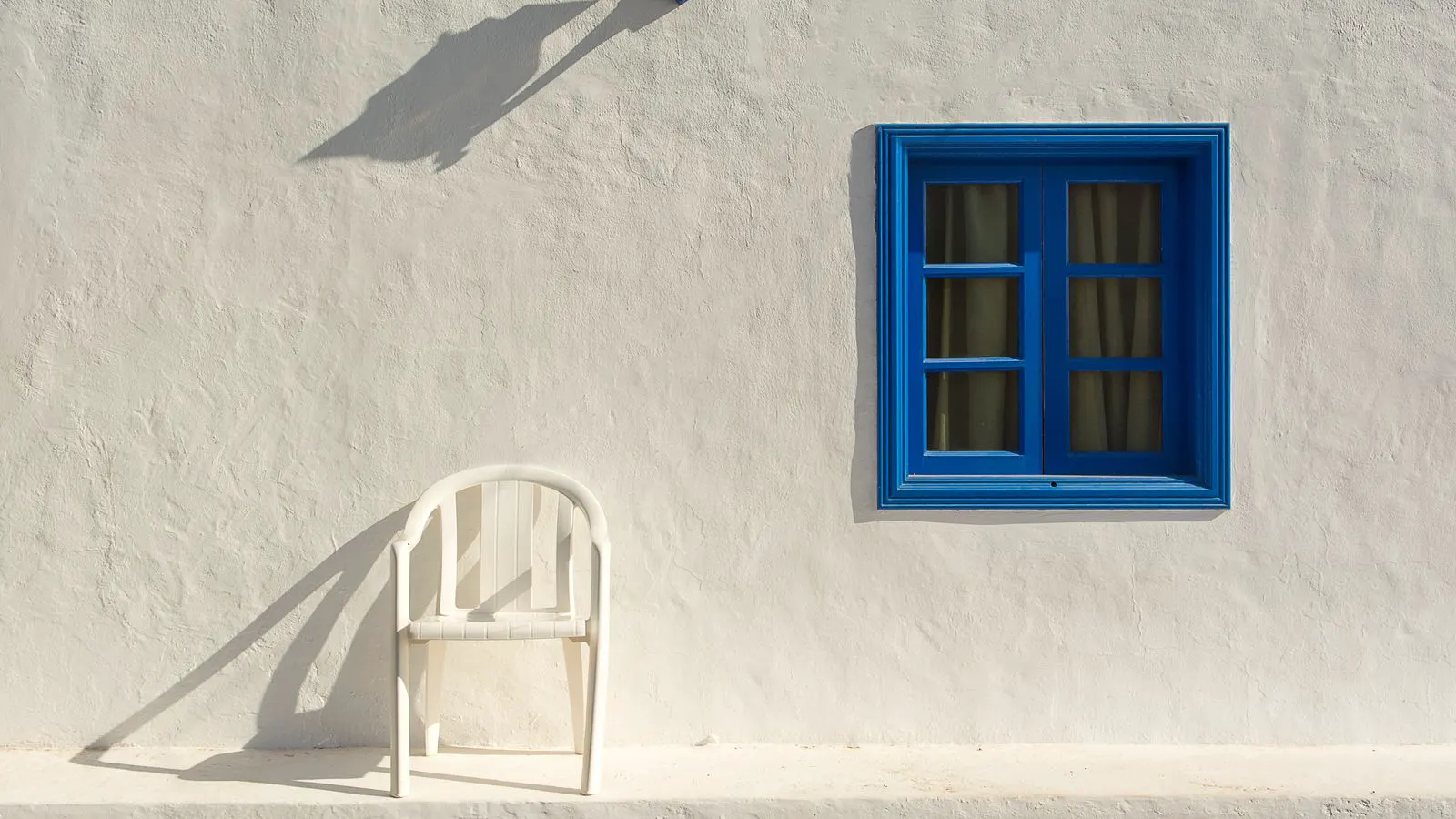 Close up of a white plastic window frame profile with visible chambers