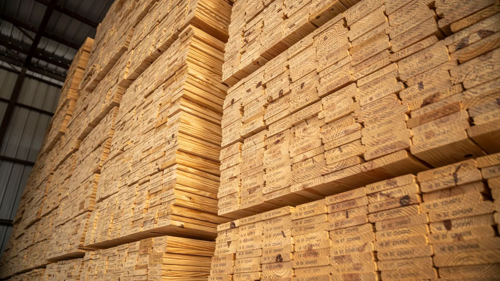Bags and coils of flooring raw materials stored in a warehouse