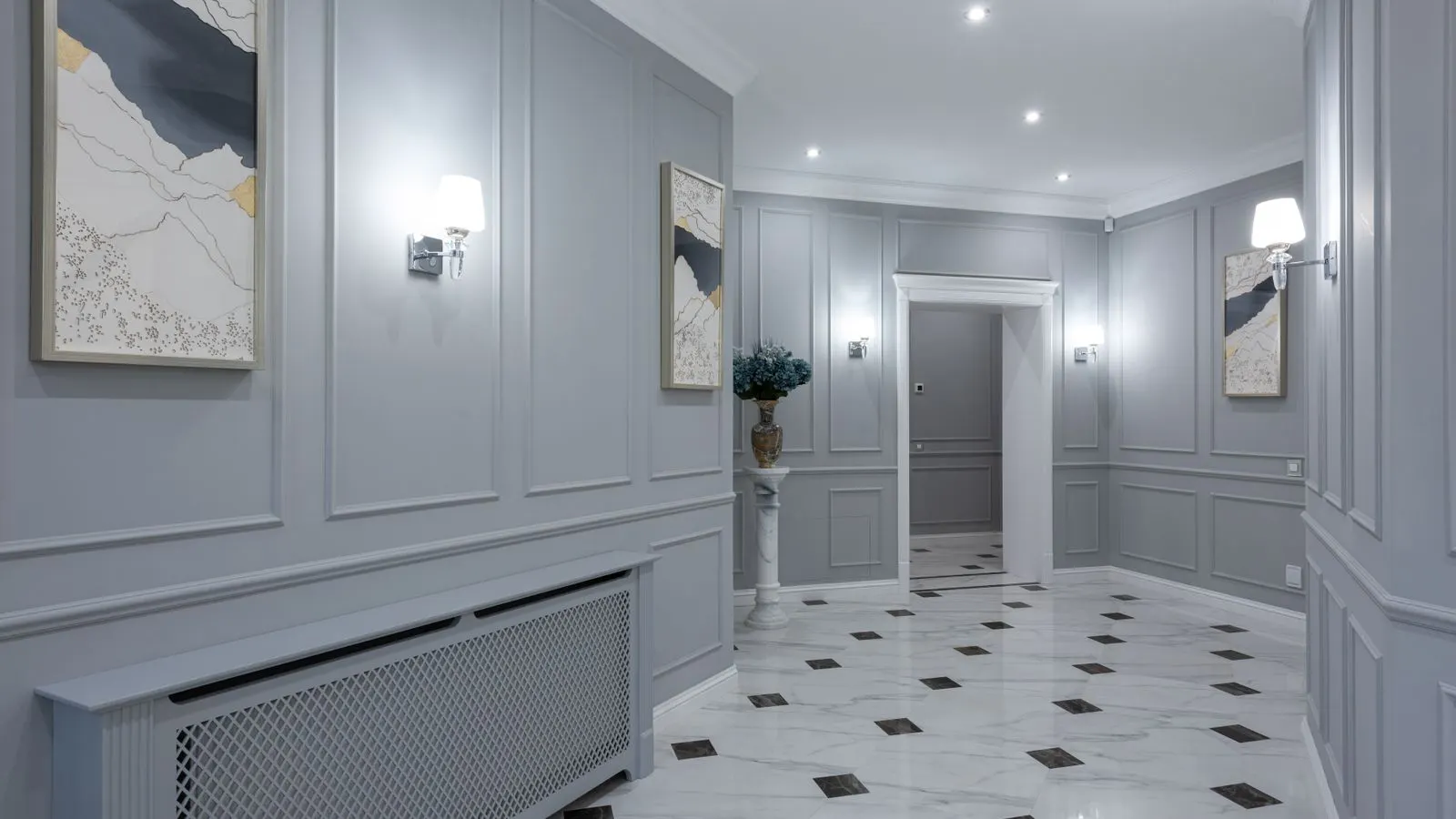 Close up view of large format porcelain tiles in a busy hallway.