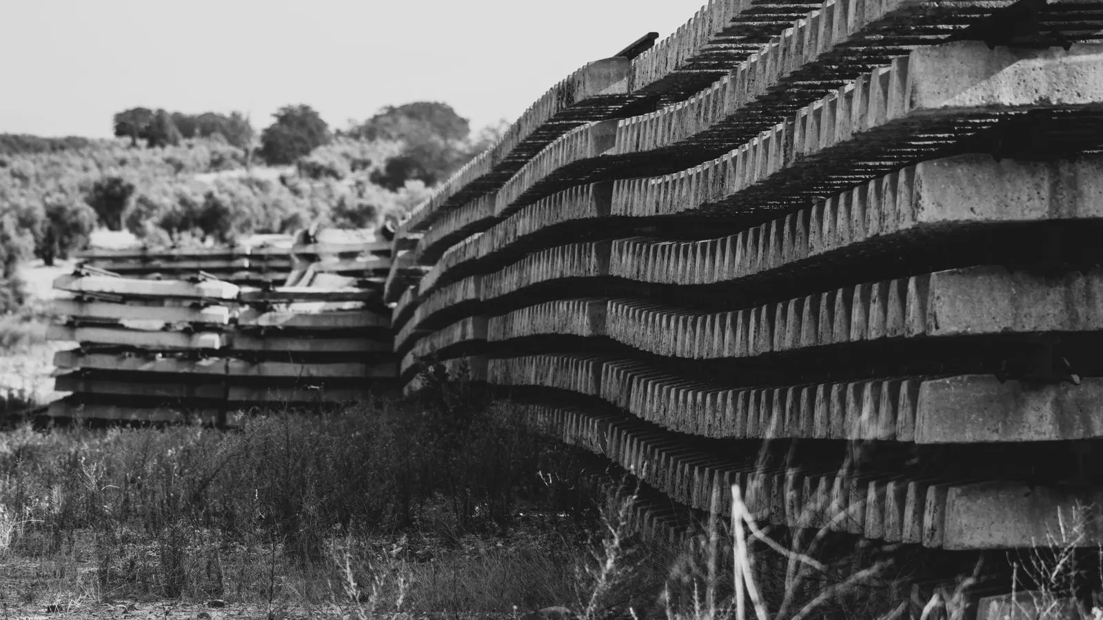 A neat stack of large ceramic slabs in a warehouse