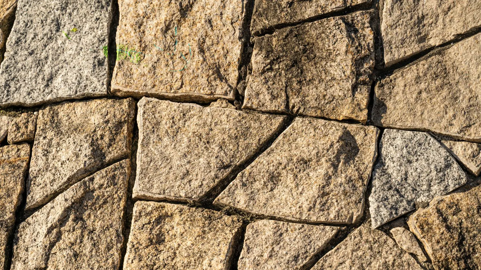 Close view of honed and polished granite slab surfaces side by side