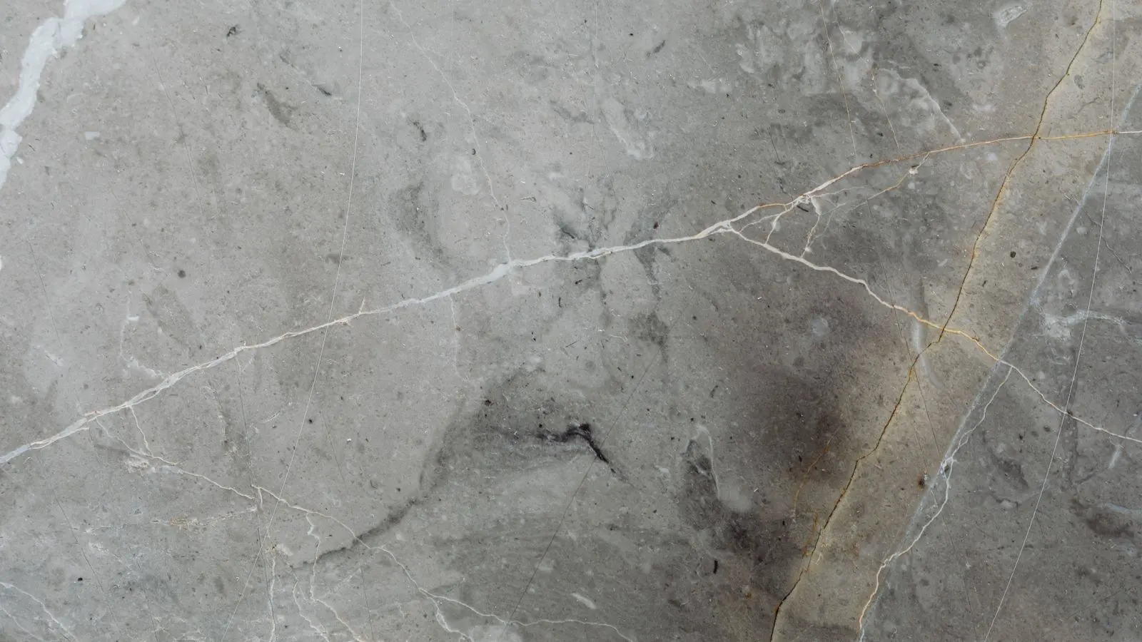Side by side granite and marble slabs showing different surface textures