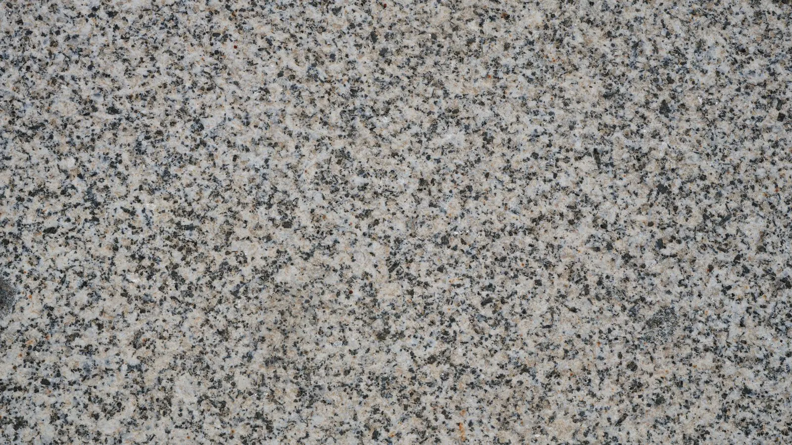 Two natural stone slabs of different colors laid side by side