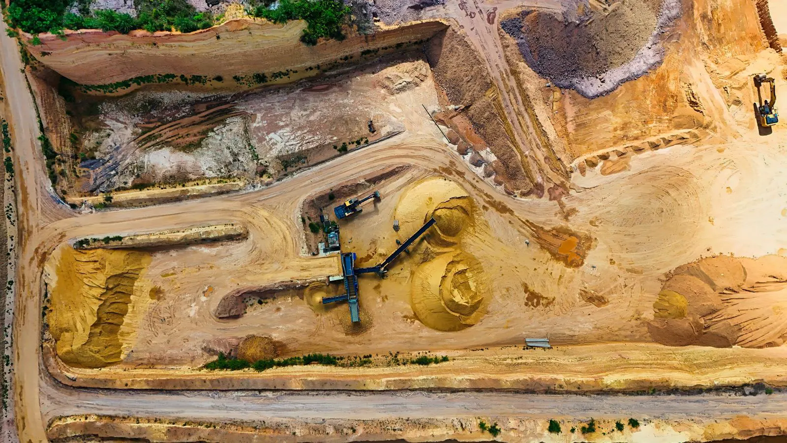 Large block of natural stone being cut in a quarry