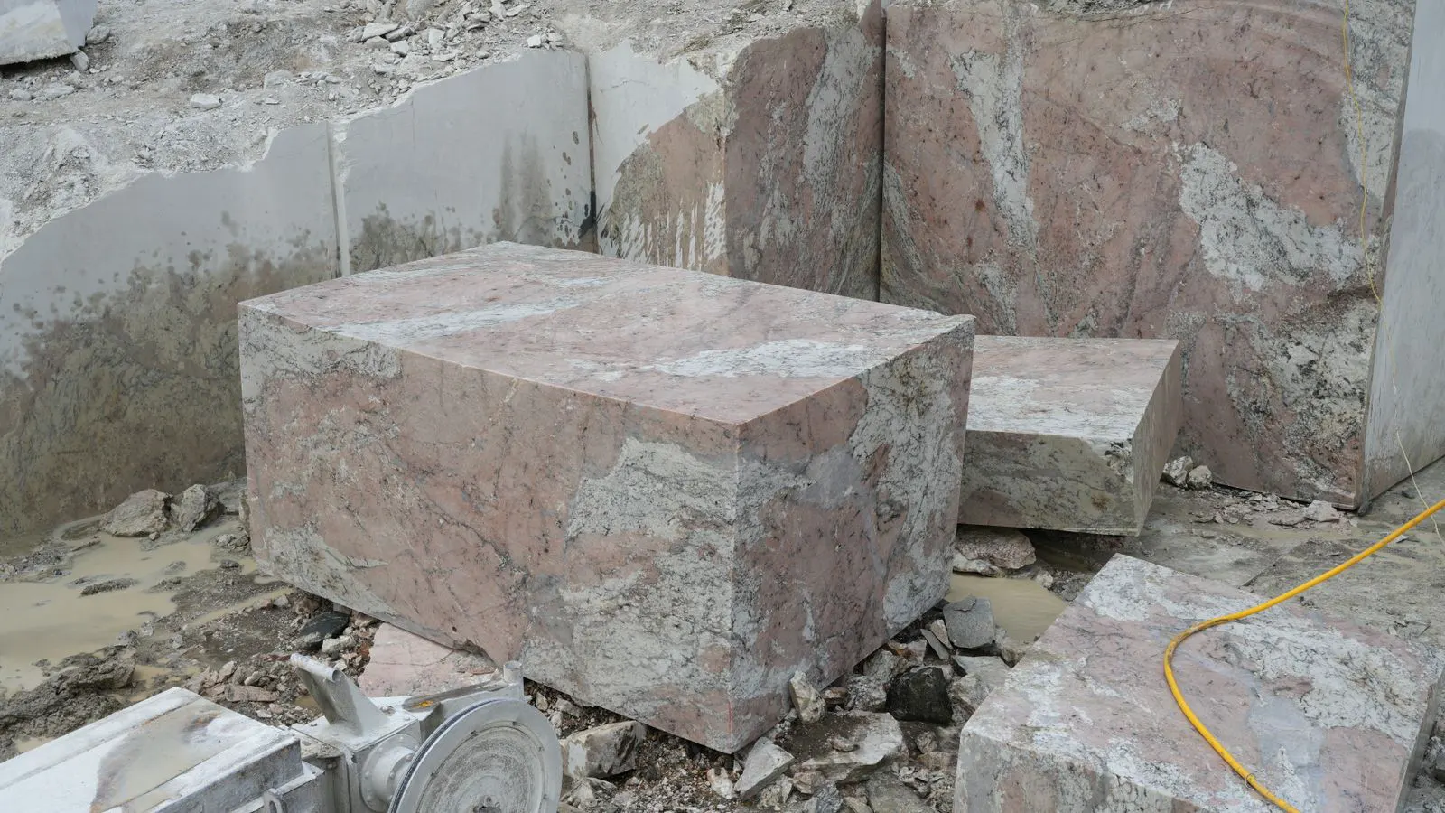 A large white marble slab showing a long crack near the edge