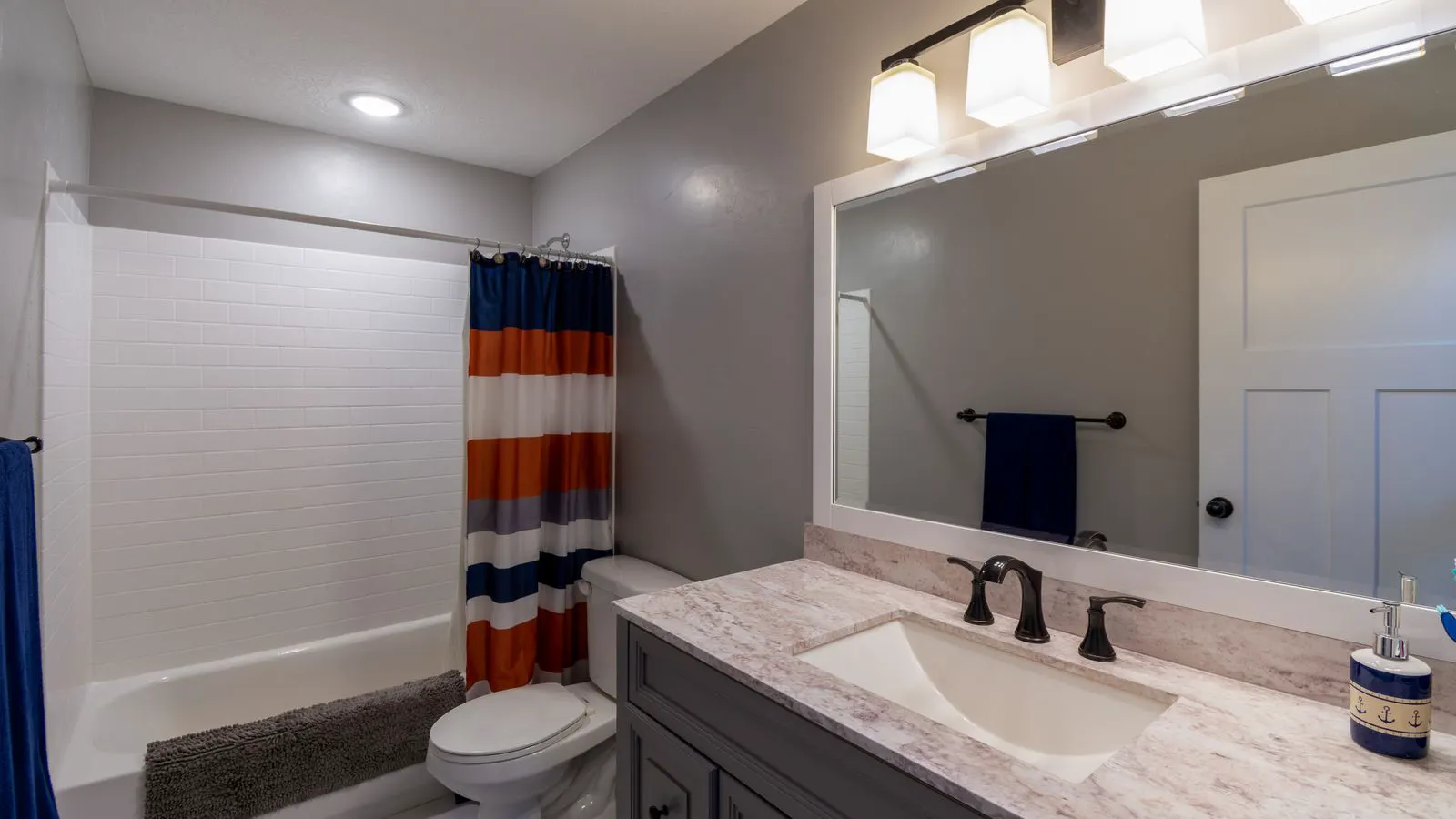 A project manager reviewing a bathroom fitting cost sheet on a clipboard.