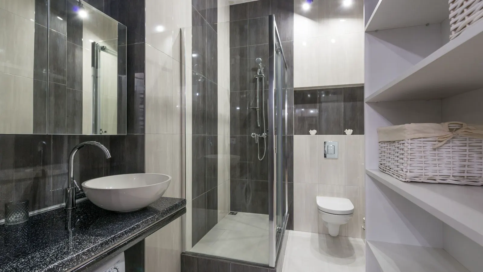 A modern bathroom featuring a clear glass shower enclosure.