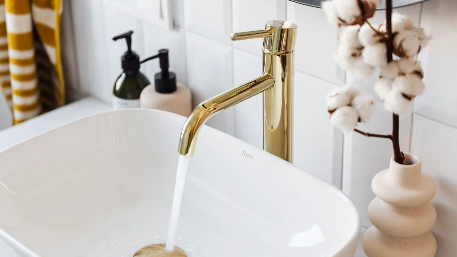 Close up of a bathroom faucet with a compliance checklist