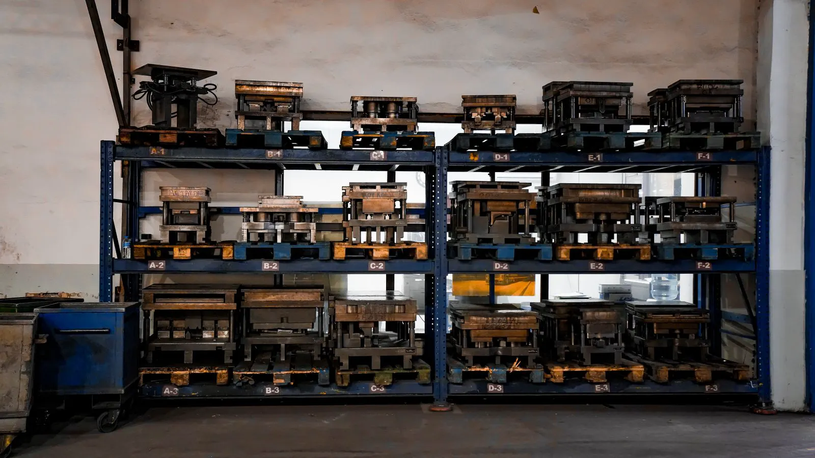 A row of printed corrugated cartons on a shelf
