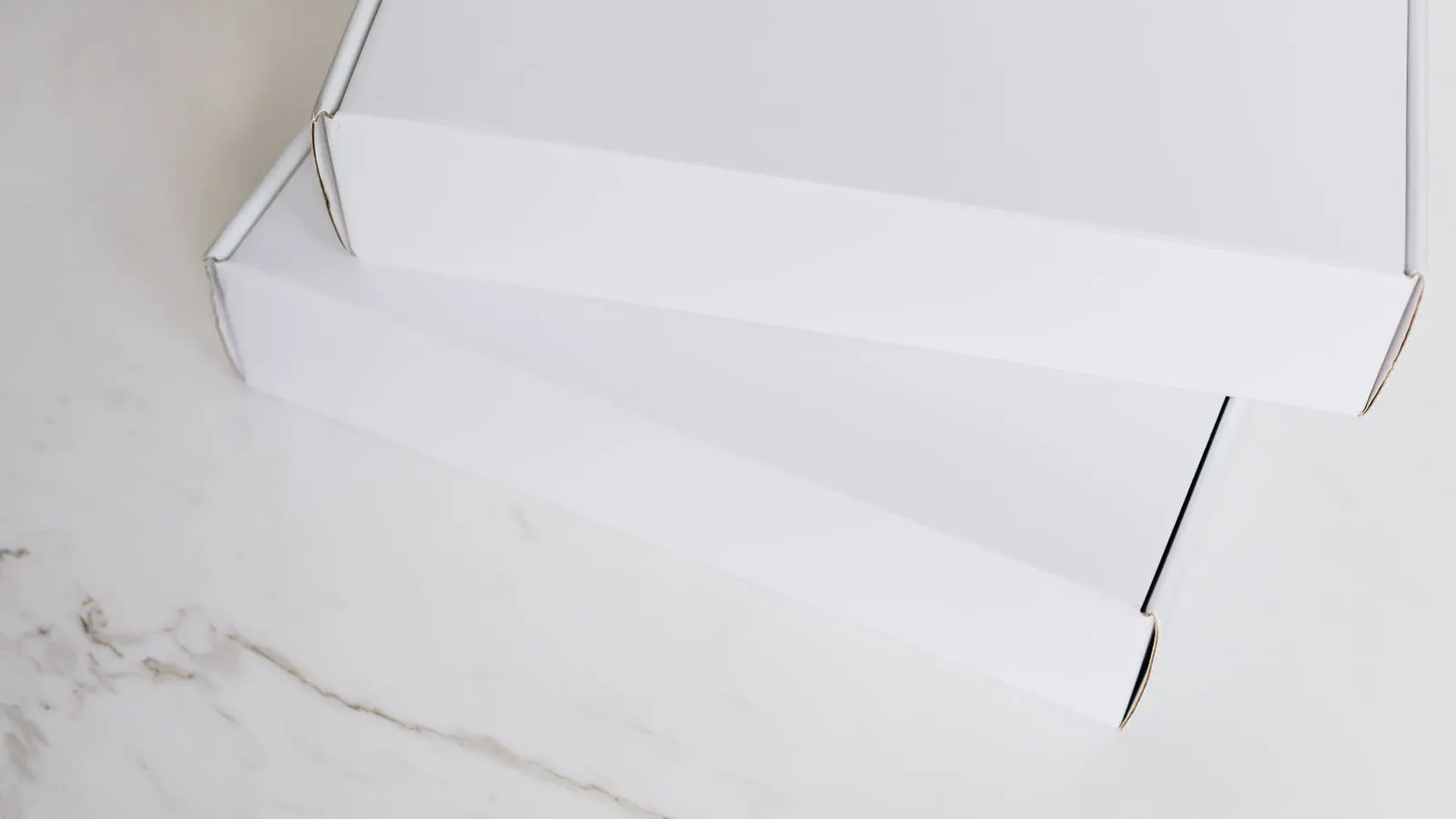 Close up of kraft and white corrugated board samples on a table