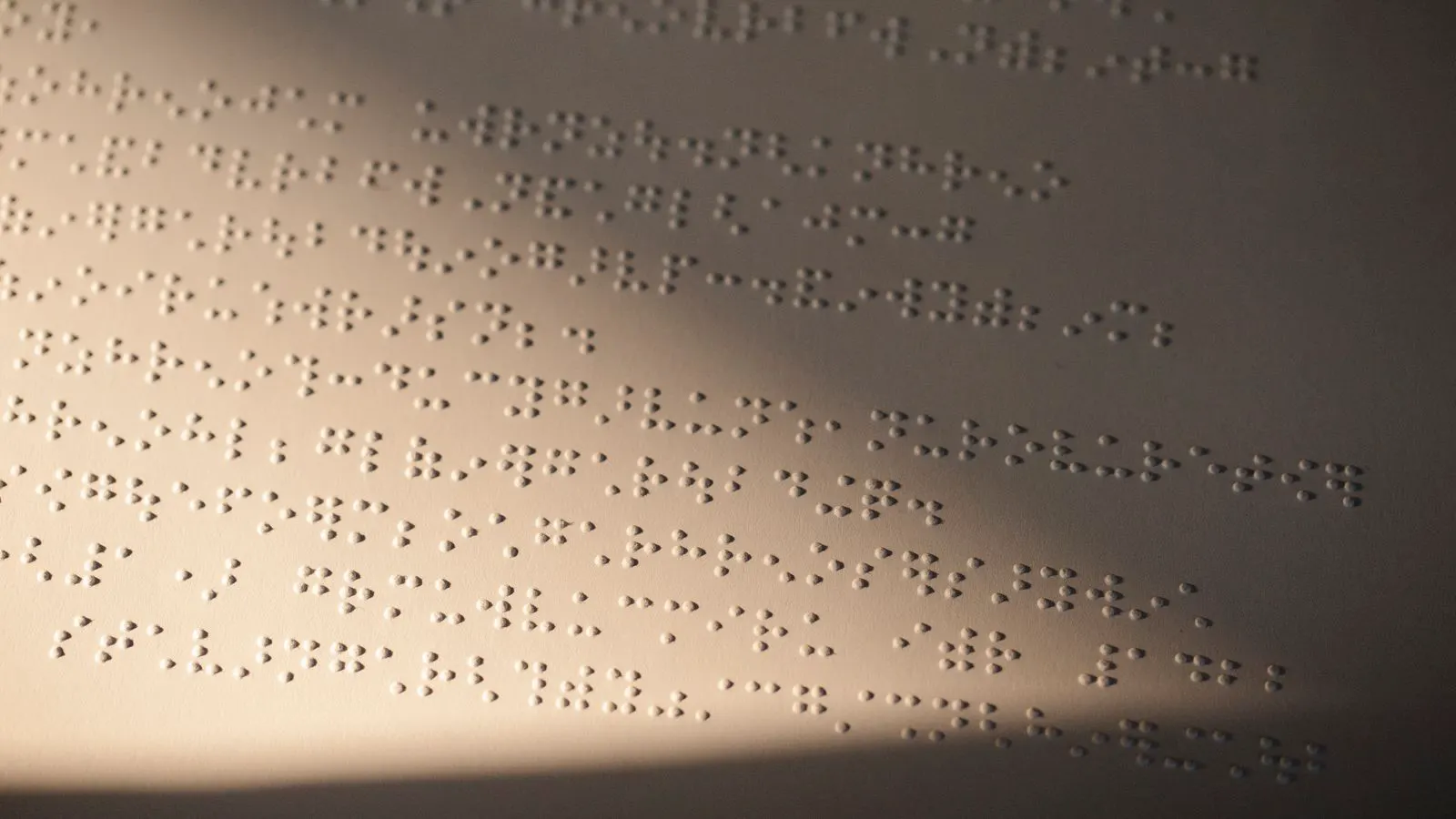 Close up of a debossed paper label under angled light