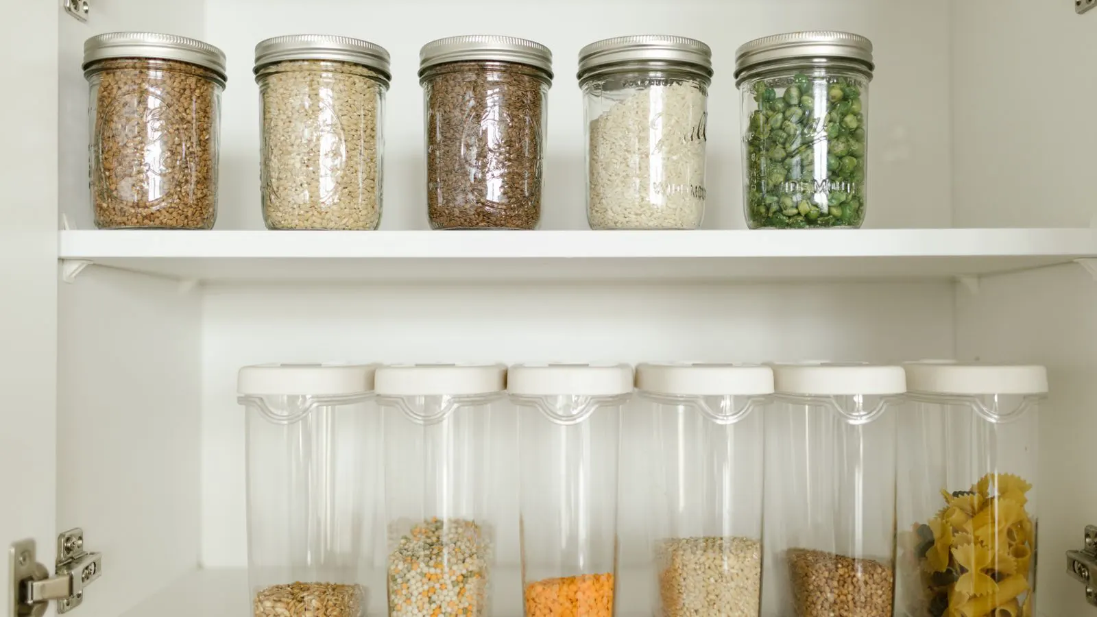 Glass and plastic jars displayed side by side on a workbench