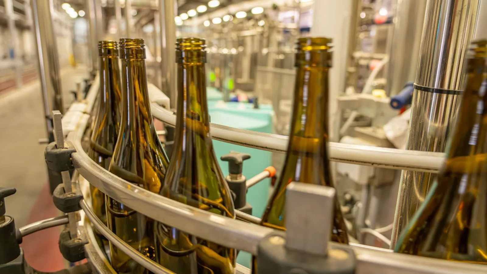 Glass bottles being inspected in a production workshop