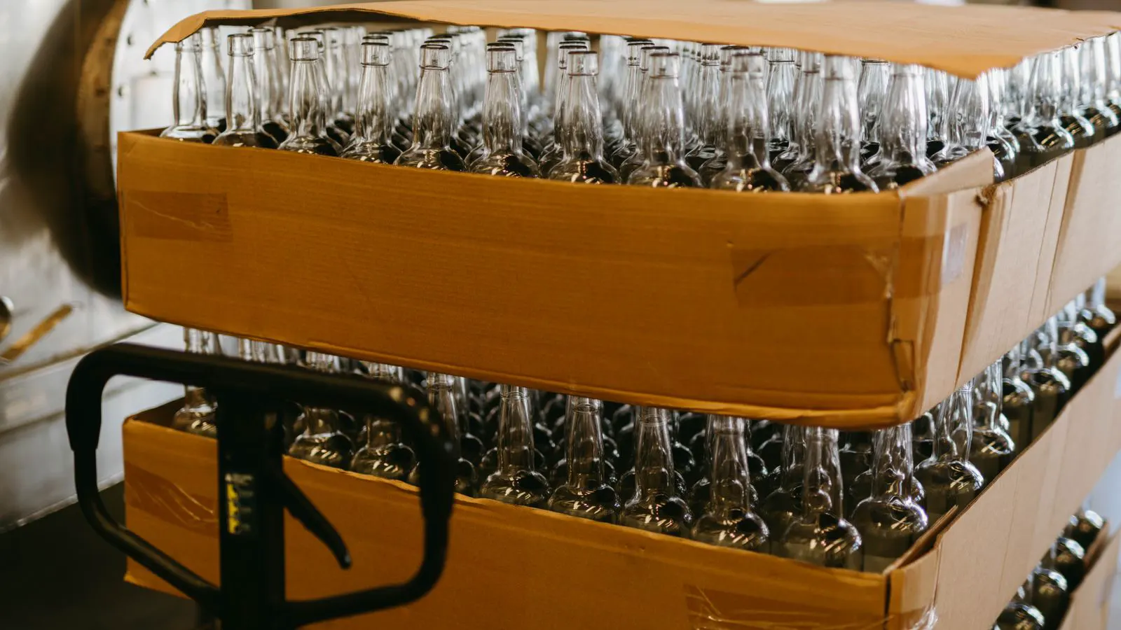 Glass bottles moving through a filling and capping station