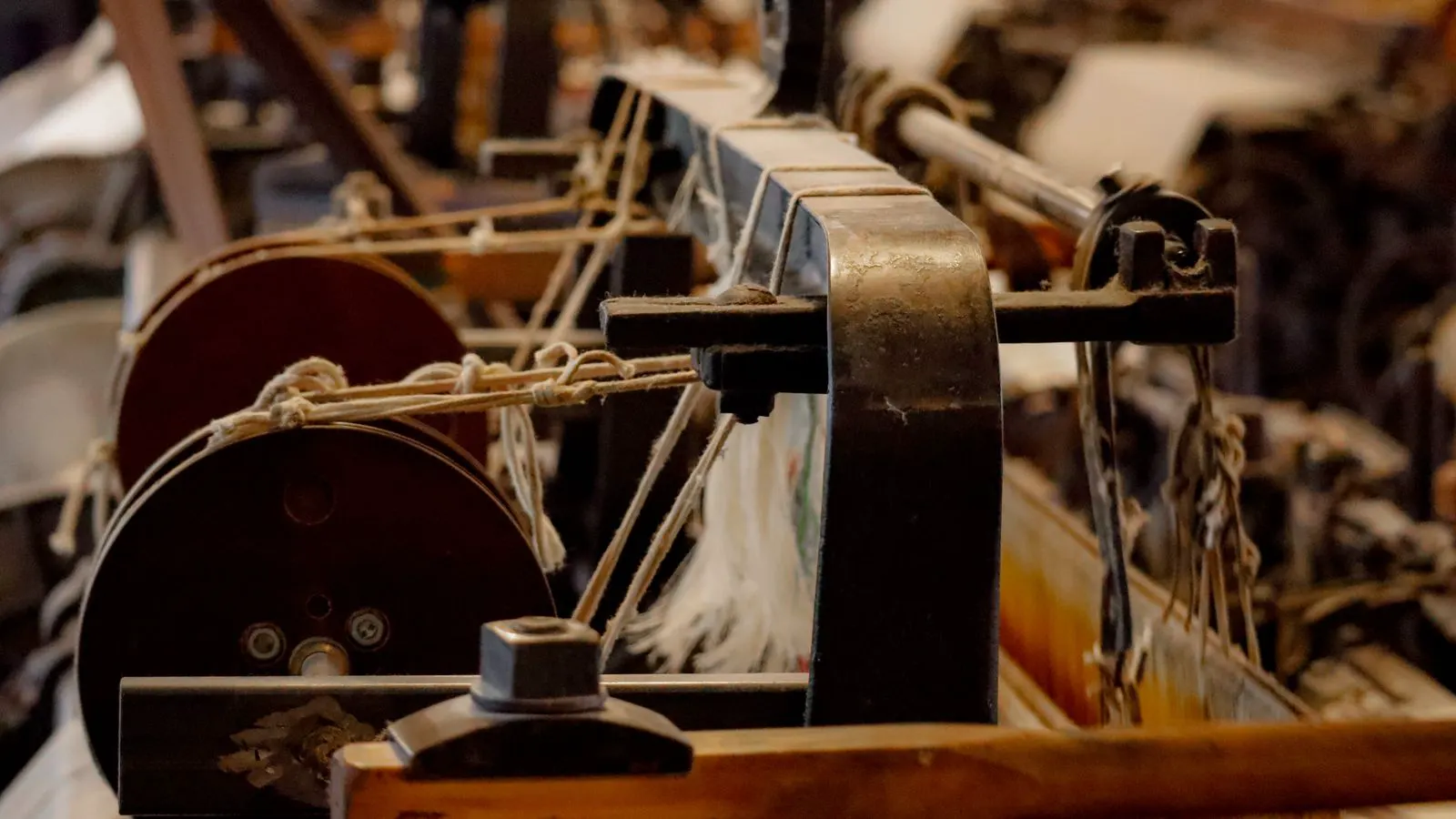 Close up view of active looms inside a textile mill.