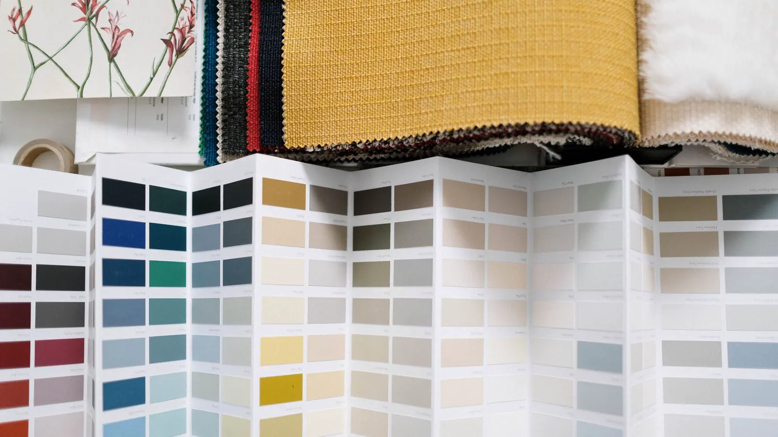 Close-up of knit and woven fabric samples on a worktable