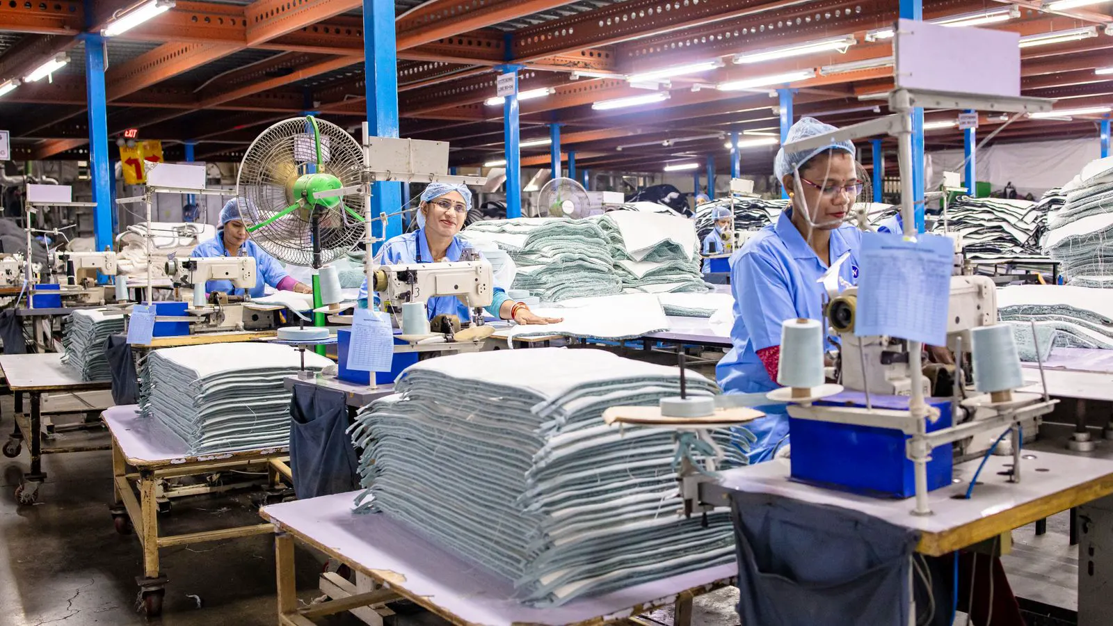 A textile factory floor with polyester fabric on production lines