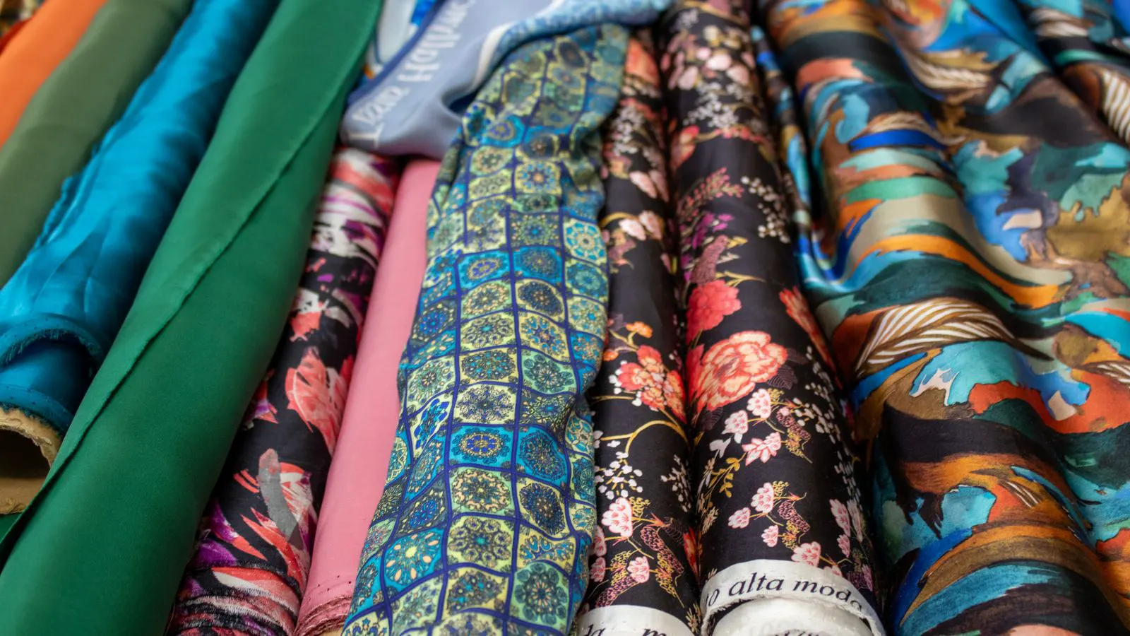 Close up view of stacked nonwoven fabric rolls in a warehouse
