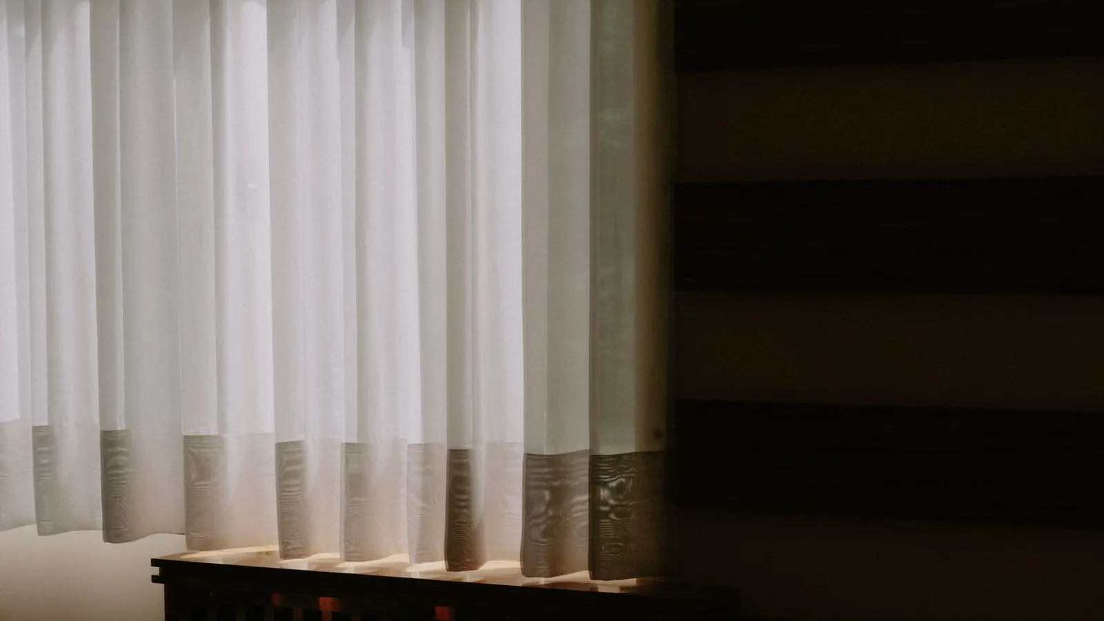 A modern window covered with textured technical fabric