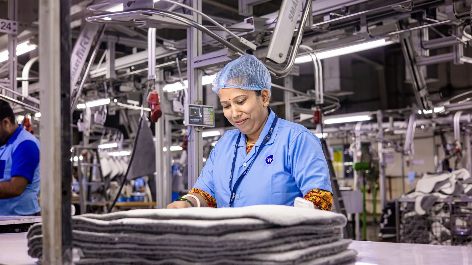 Workers assembling casual sneakers on a production line