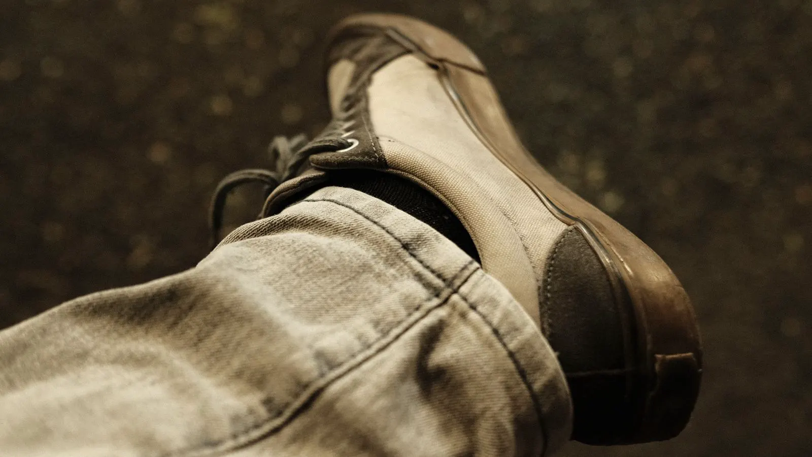 Close-up view of a casual shoe outsole showing rubber tread pattern.