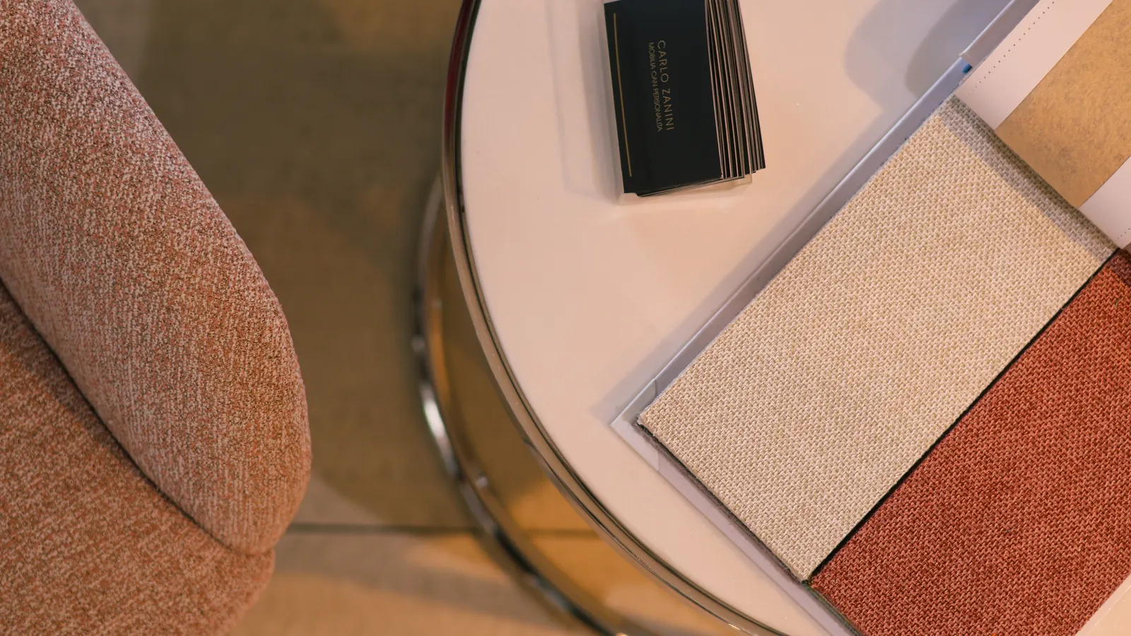 Various leather and fabric lining samples arranged on a workbench