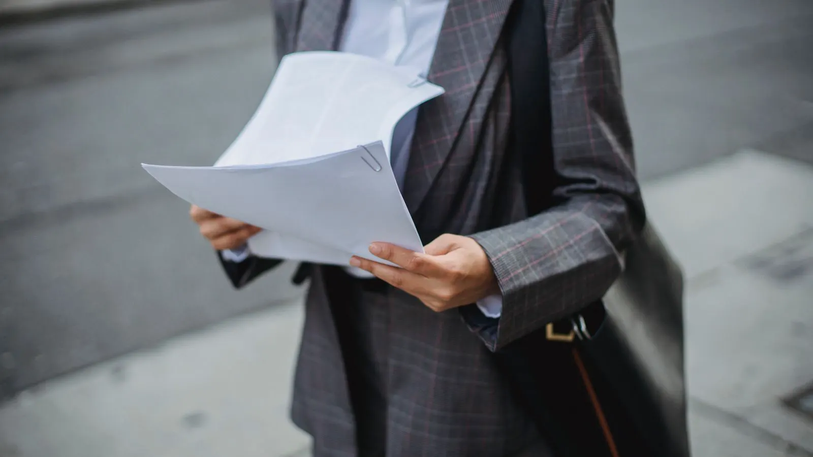Auditor checking quality management records at supplier facility