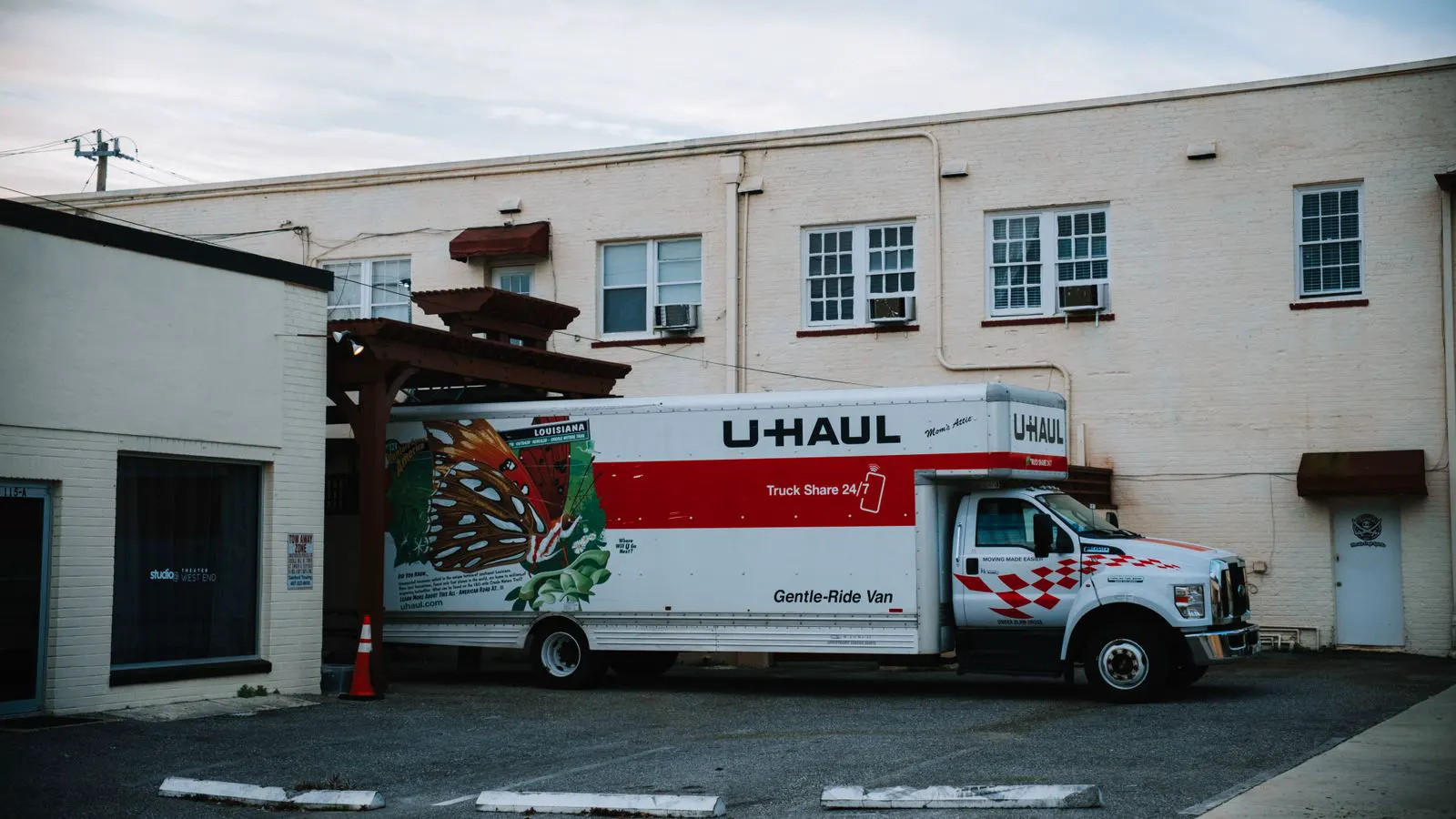 A distribution center worker checks a pallet of automotive components