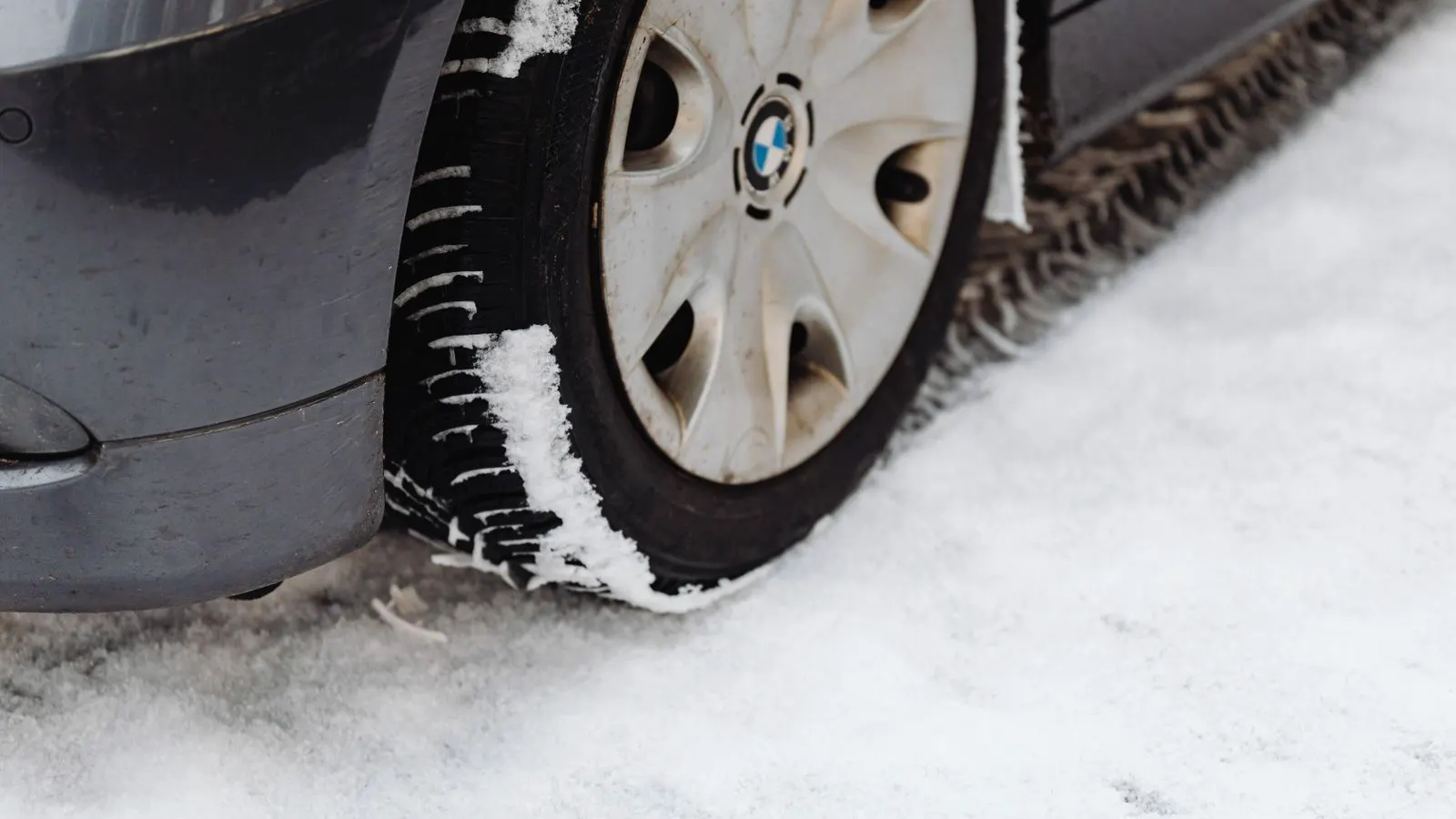 A passenger car tire showing tread pattern and sidewall details.