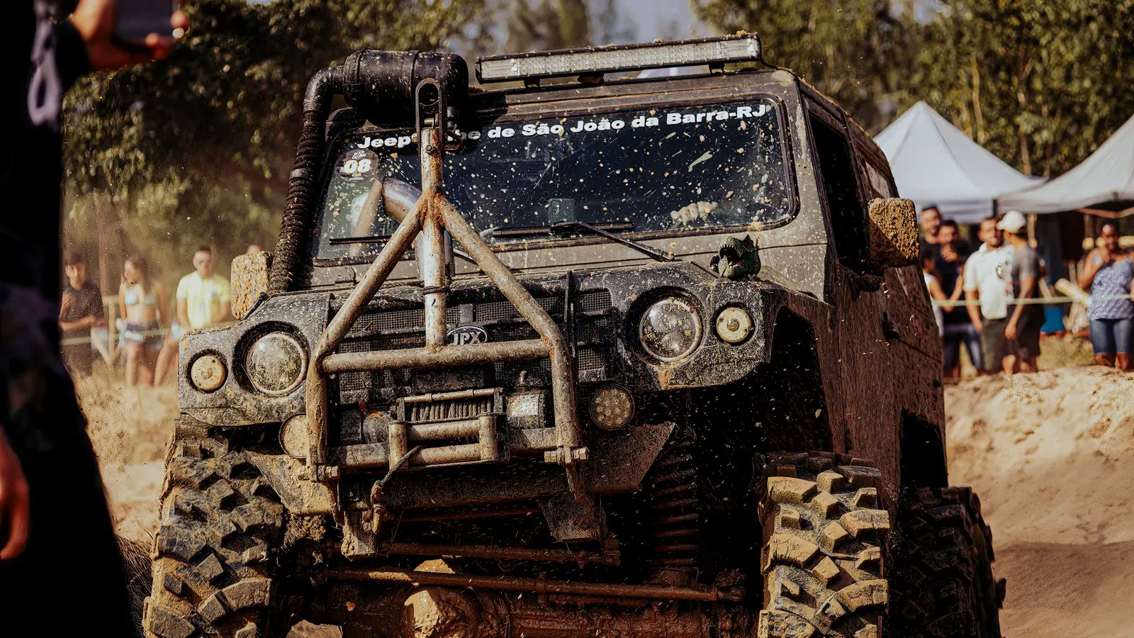 Heavy machinery tires with deep treads in muddy conditions